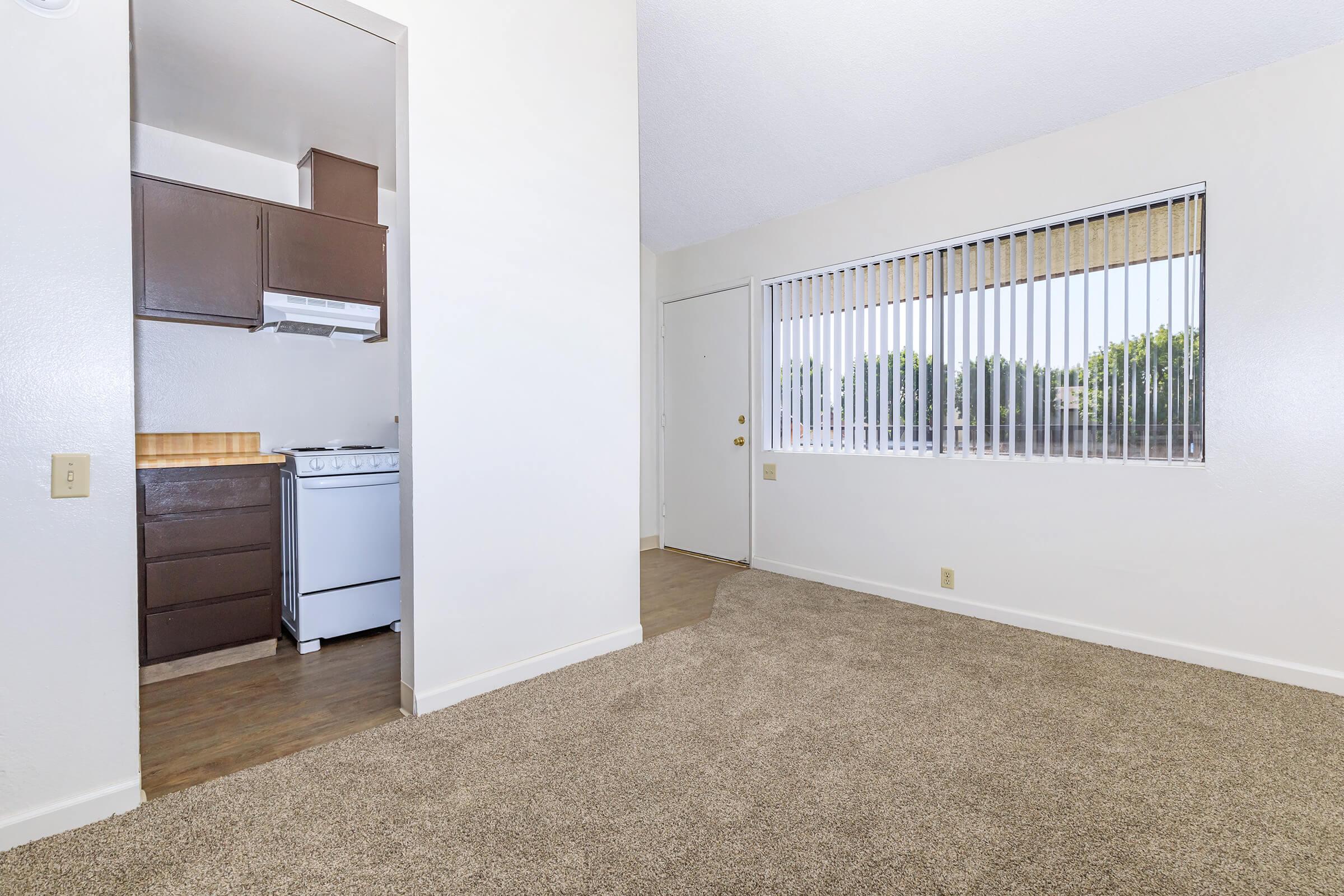 a double door refrigerator in the corner of a room