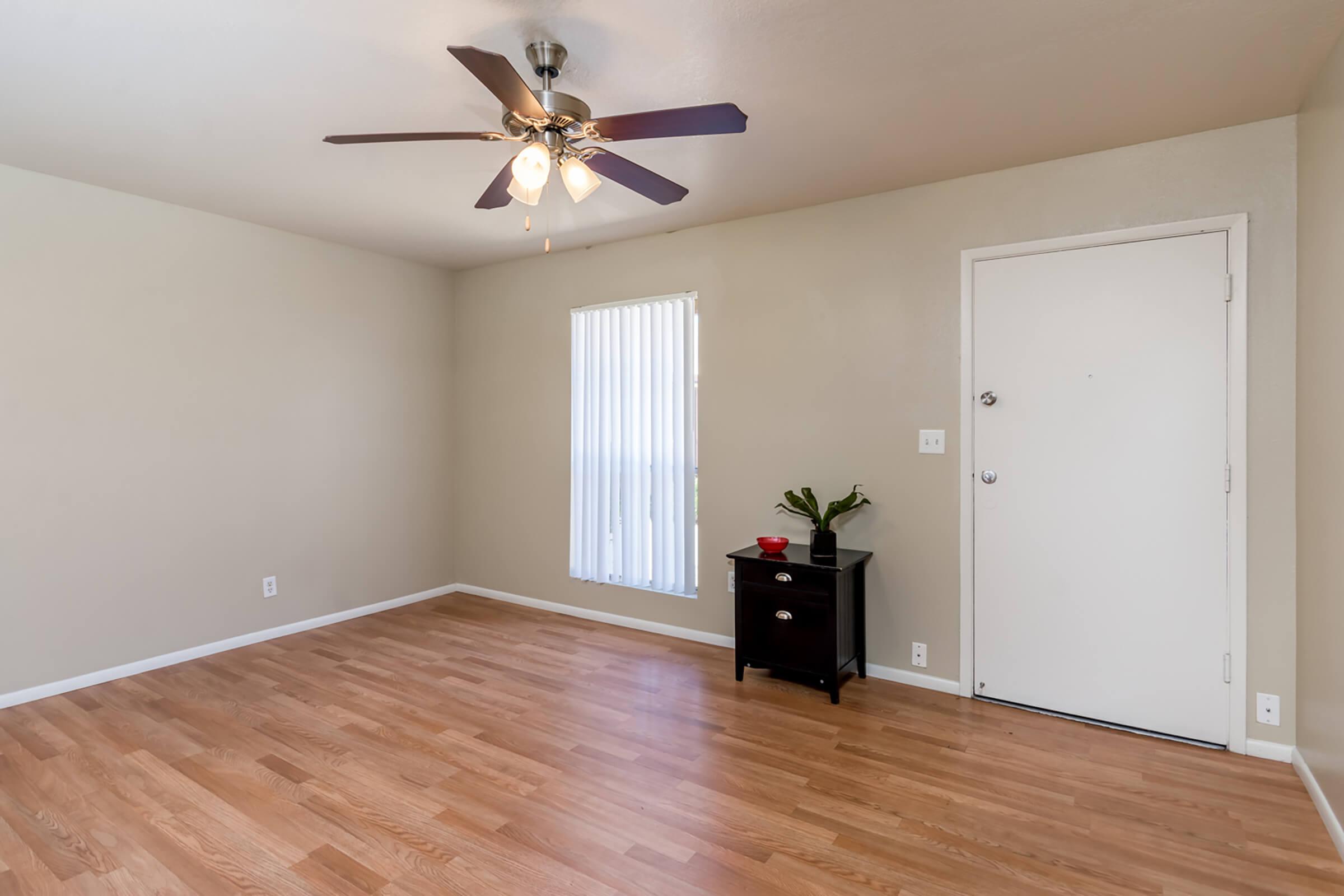 a living room with a hard wood floor