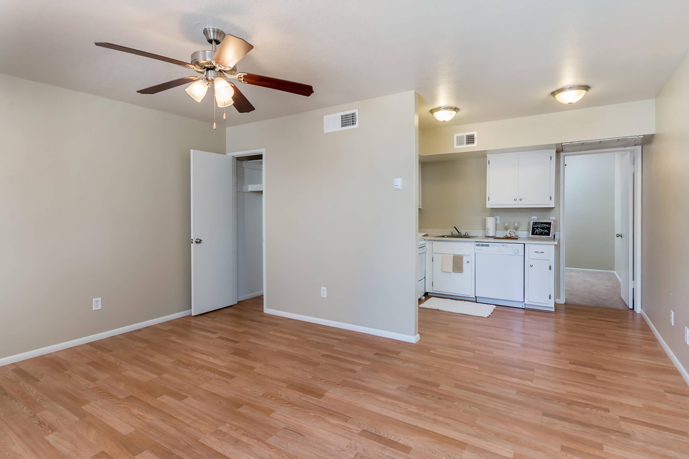 a kitchen with a hard wood floor