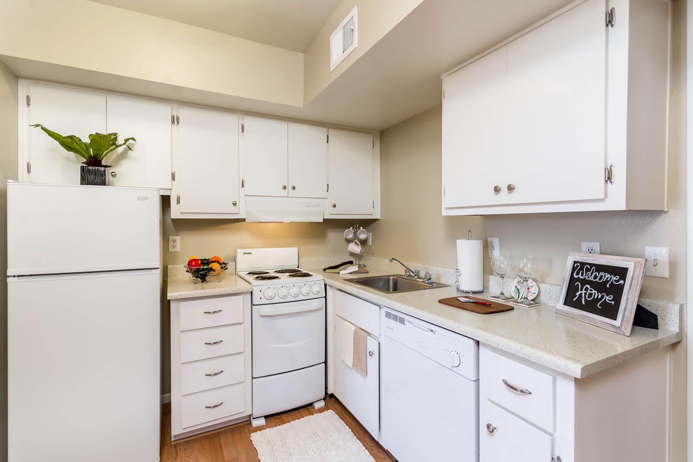 a kitchen with a stove top oven sitting inside of a refrigerator