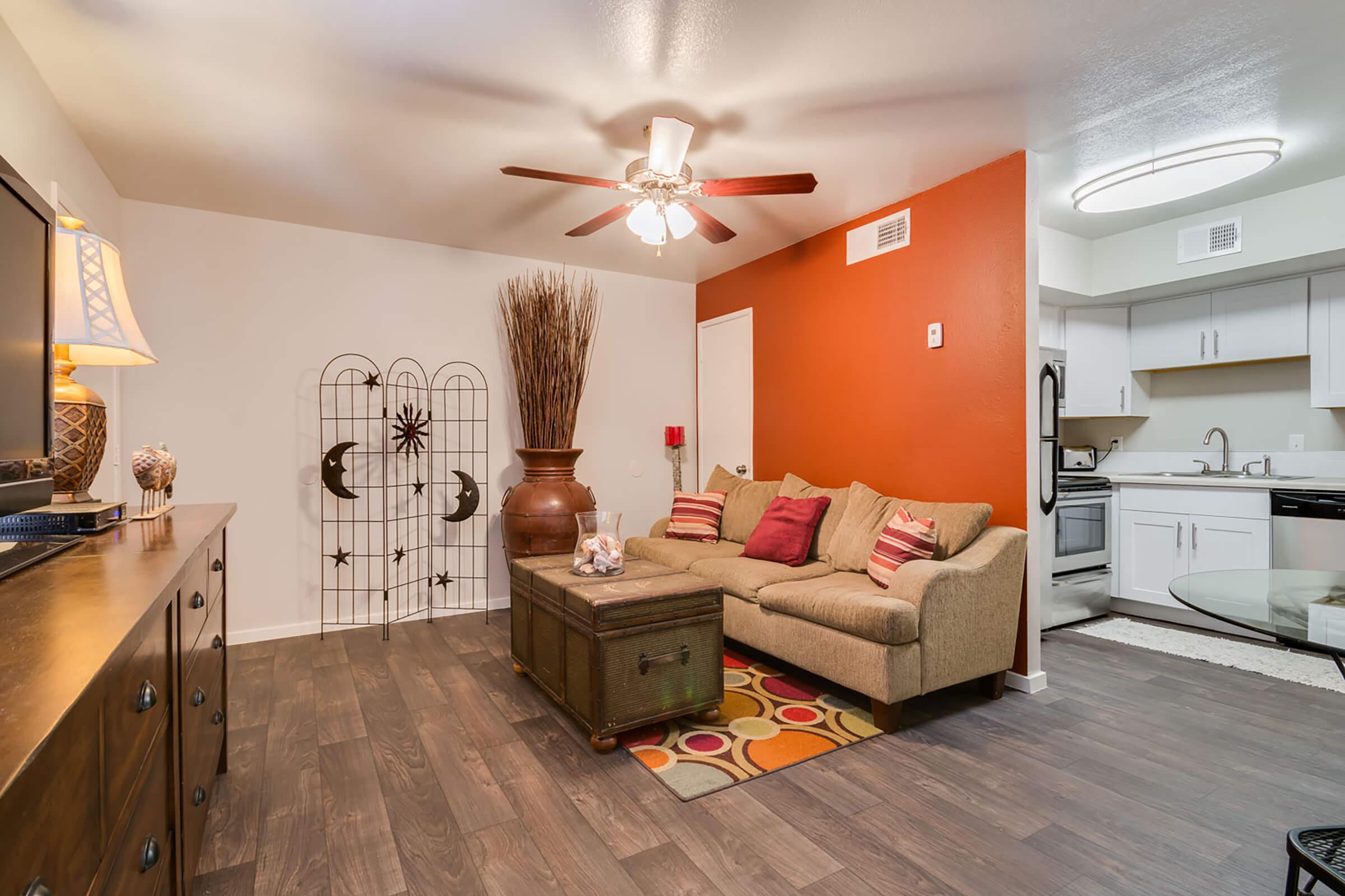 a living room filled with furniture and a tv