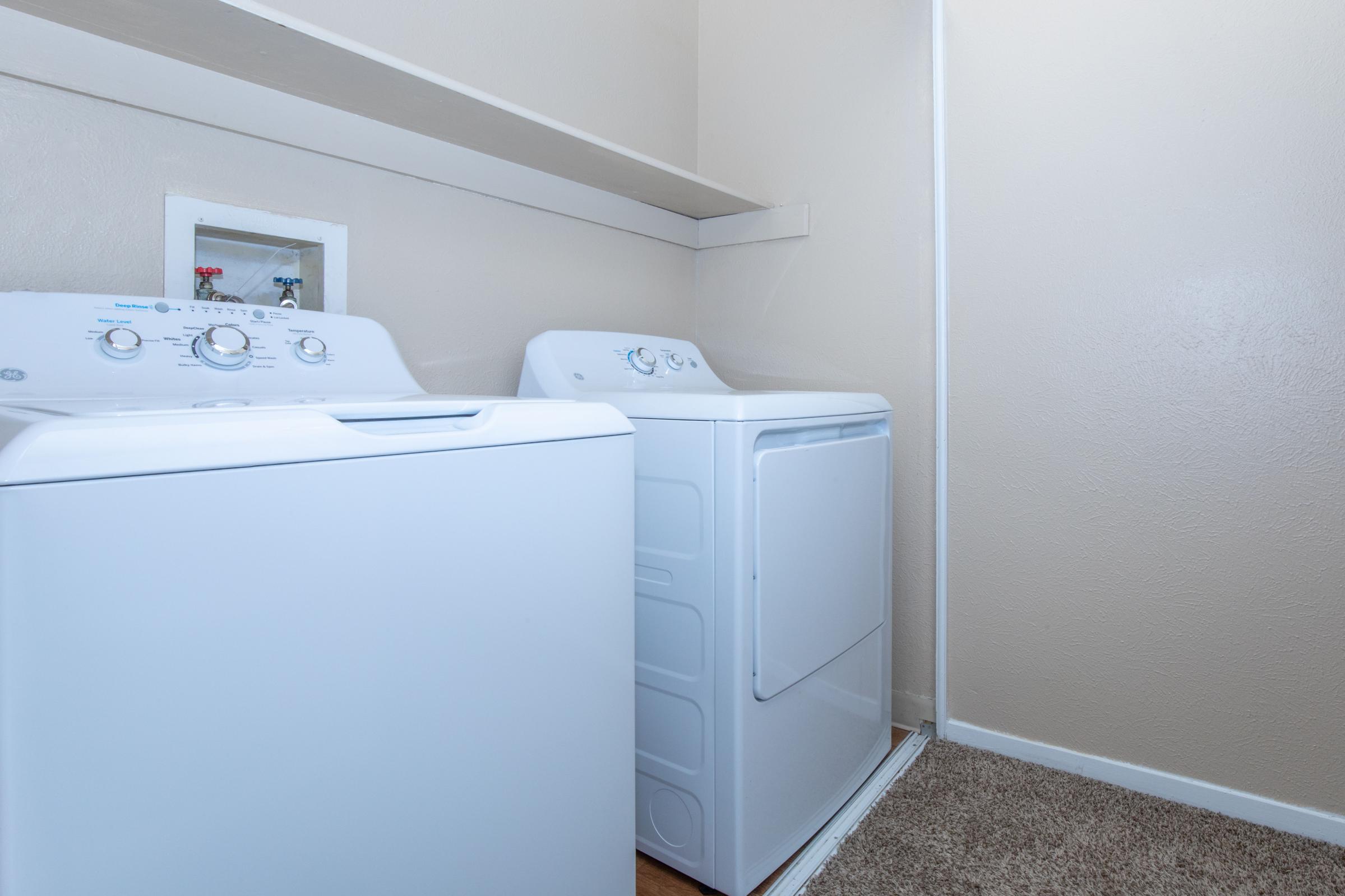 a kitchen with a sink and a refrigerator