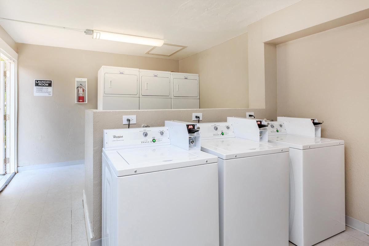 a large white refrigerator in a kitchen