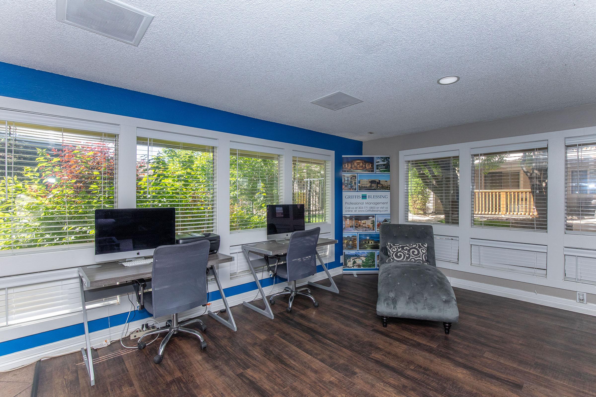 a room filled with furniture and a large window