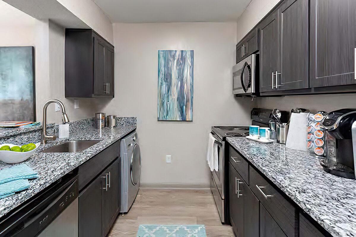 a modern kitchen with stainless steel appliances