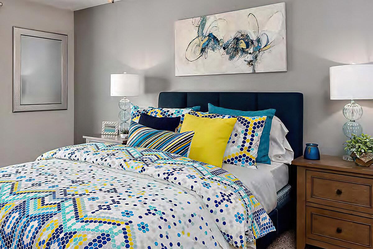 a bedroom with a bed in a room
