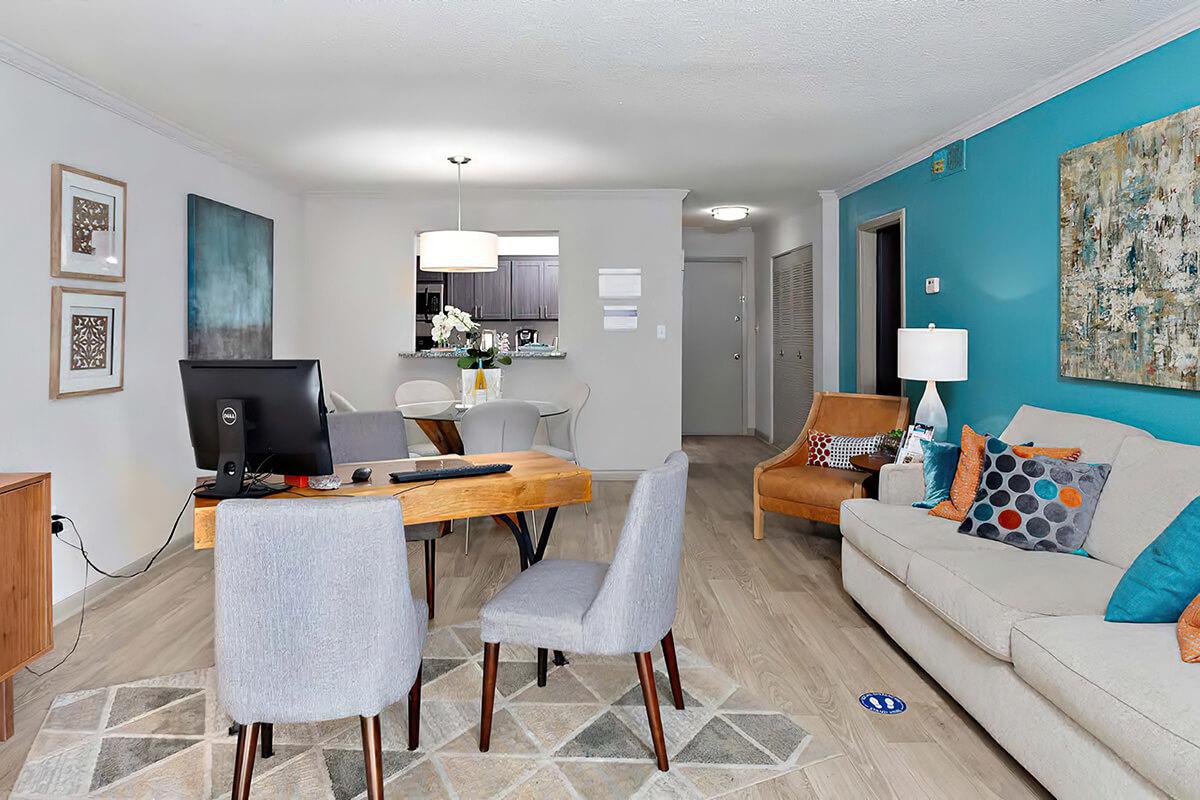 a living room filled with furniture and a tv