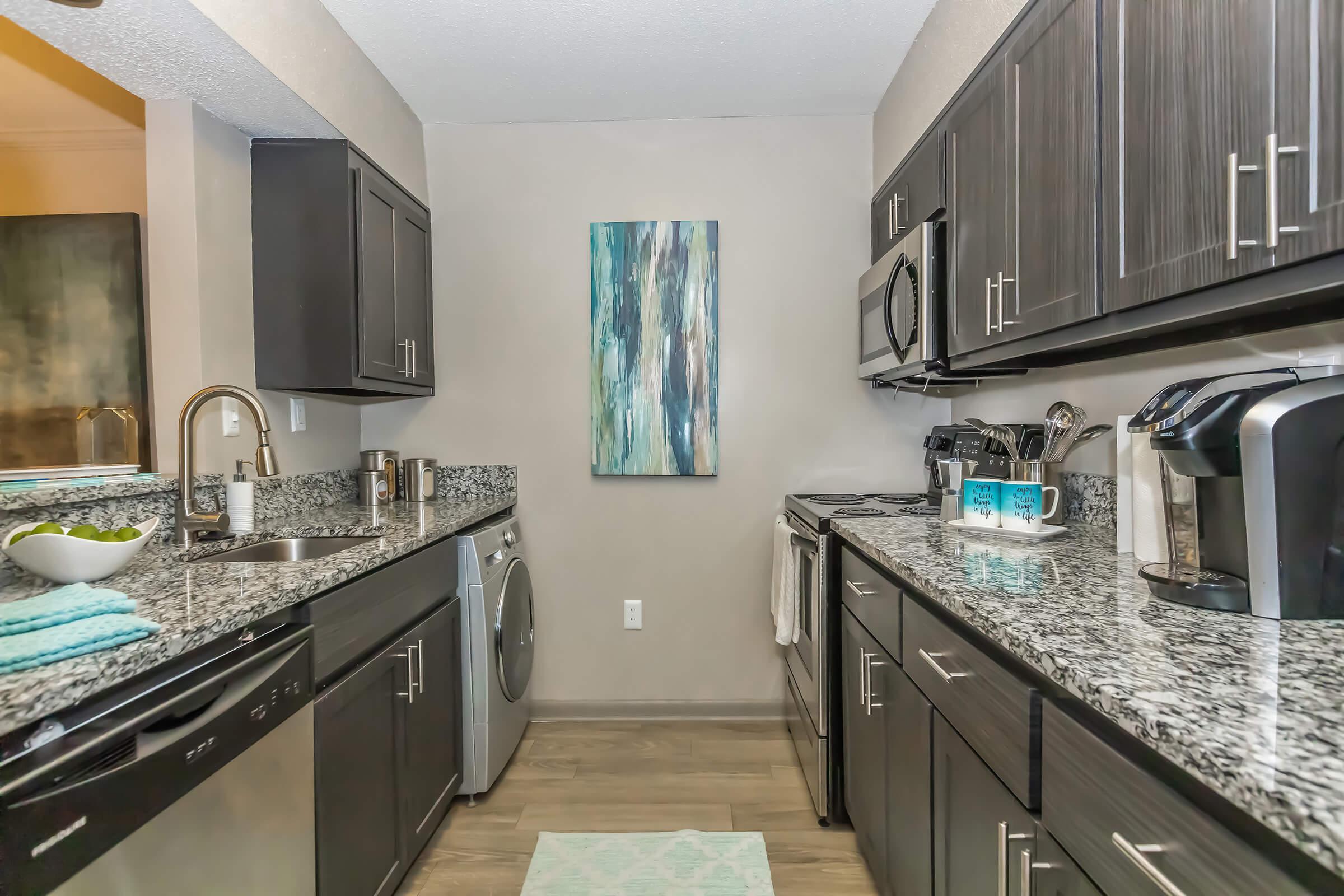 a large kitchen with stainless steel appliances