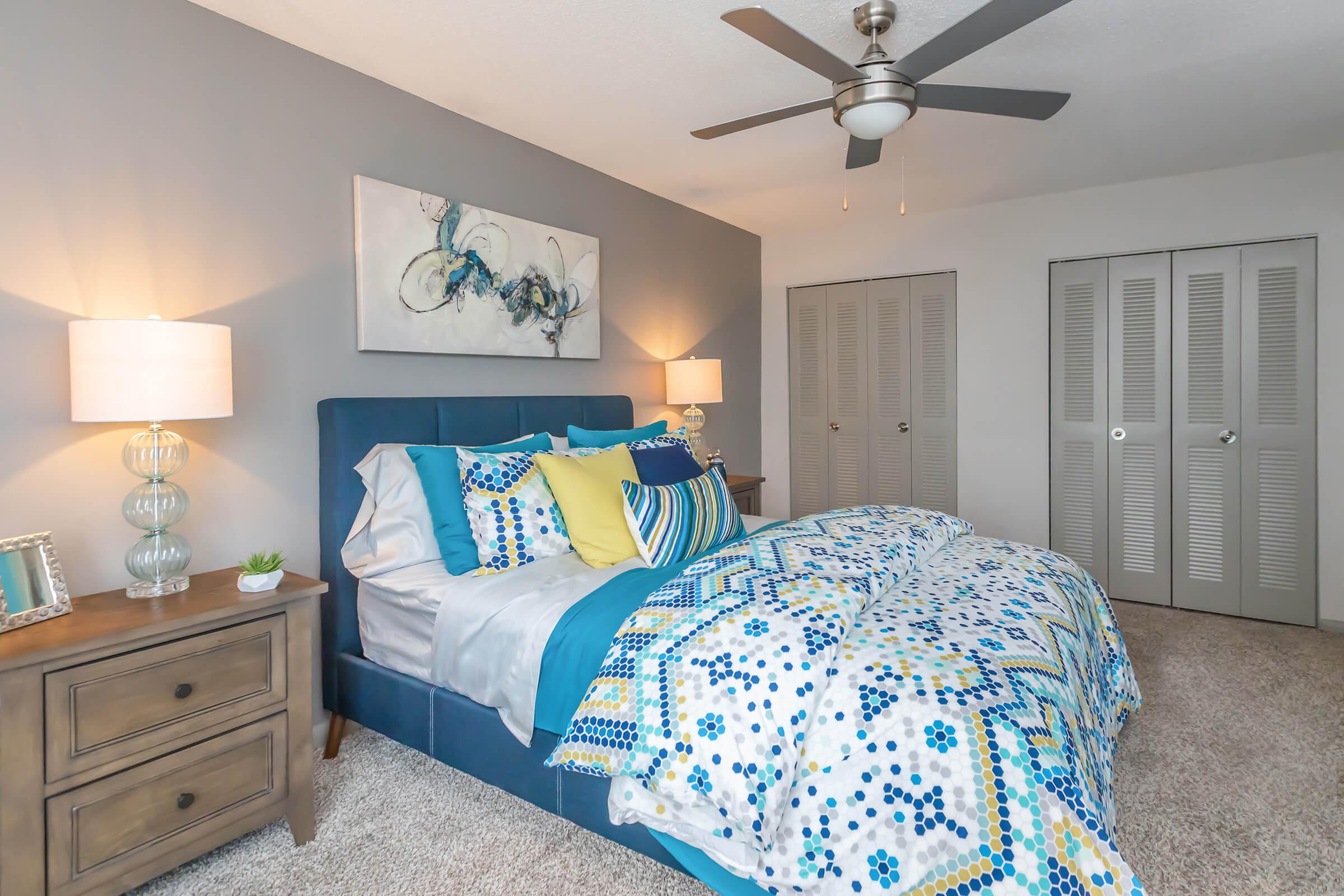a bedroom with a bed in a room