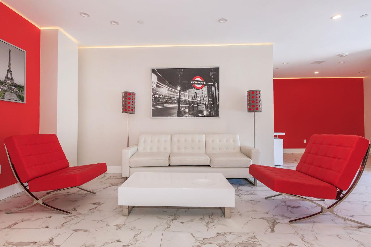 a large red chair in the living room