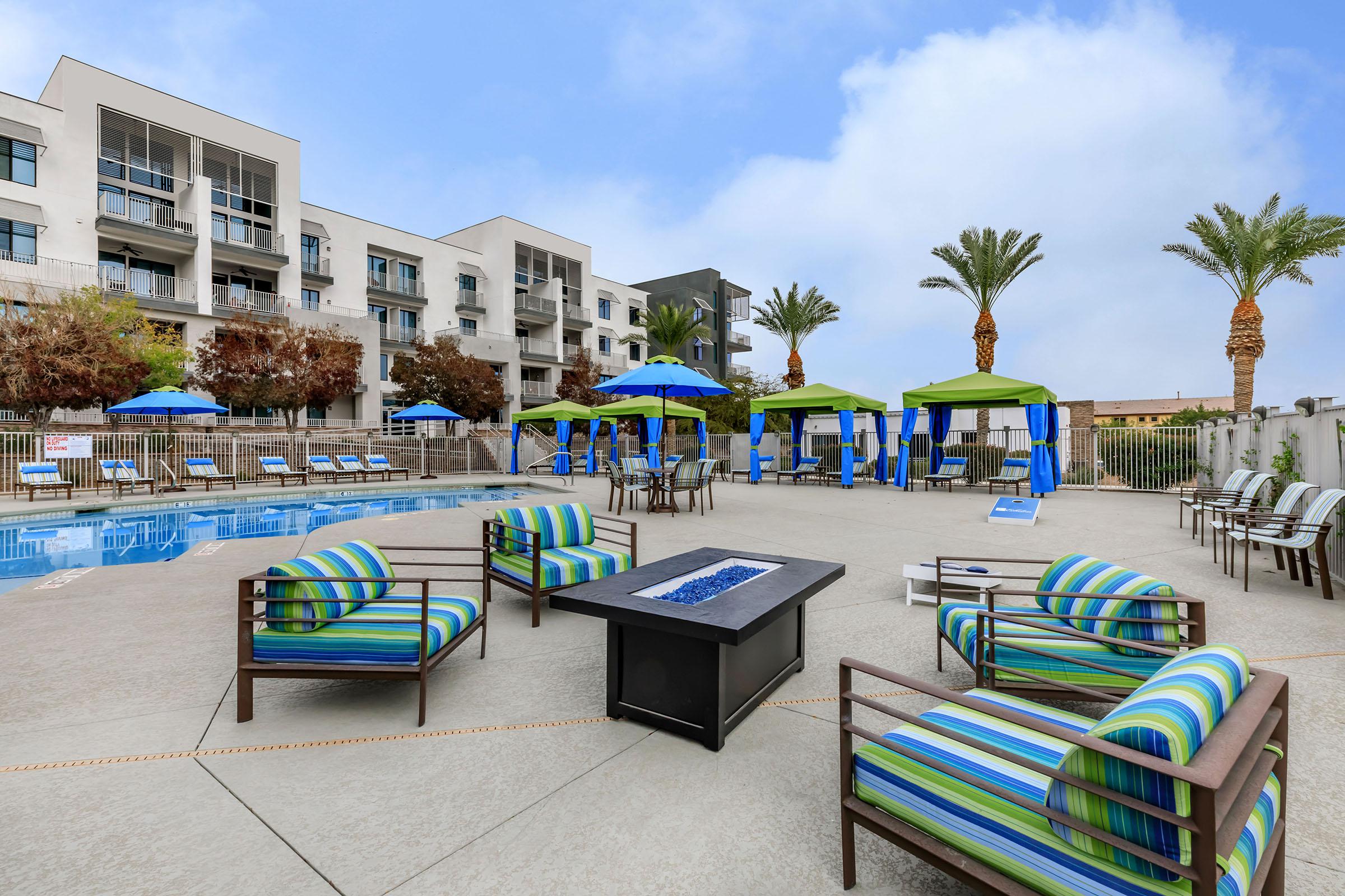 a group of lawn chairs sitting on top of a beach