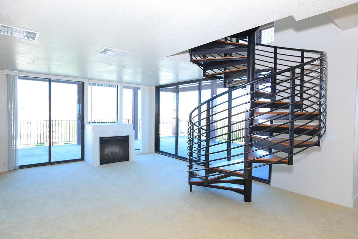 a room filled with furniture and a large window
