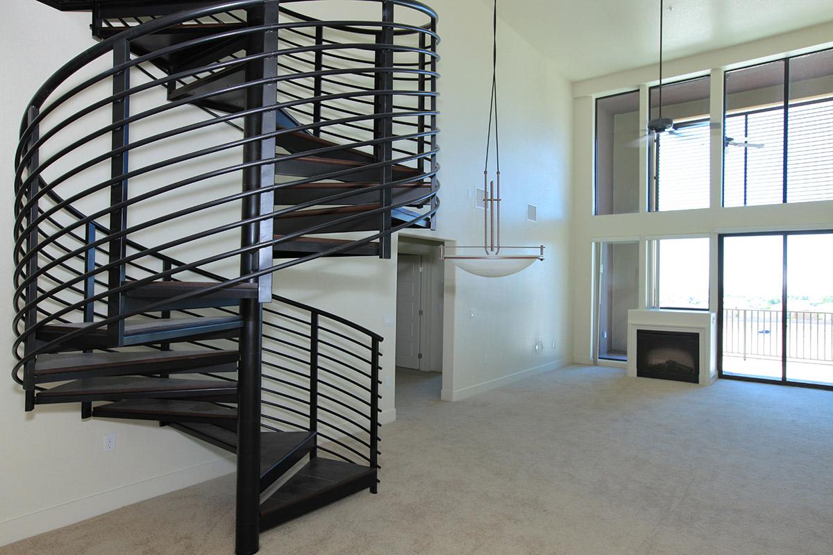 a room filled with furniture and a large window