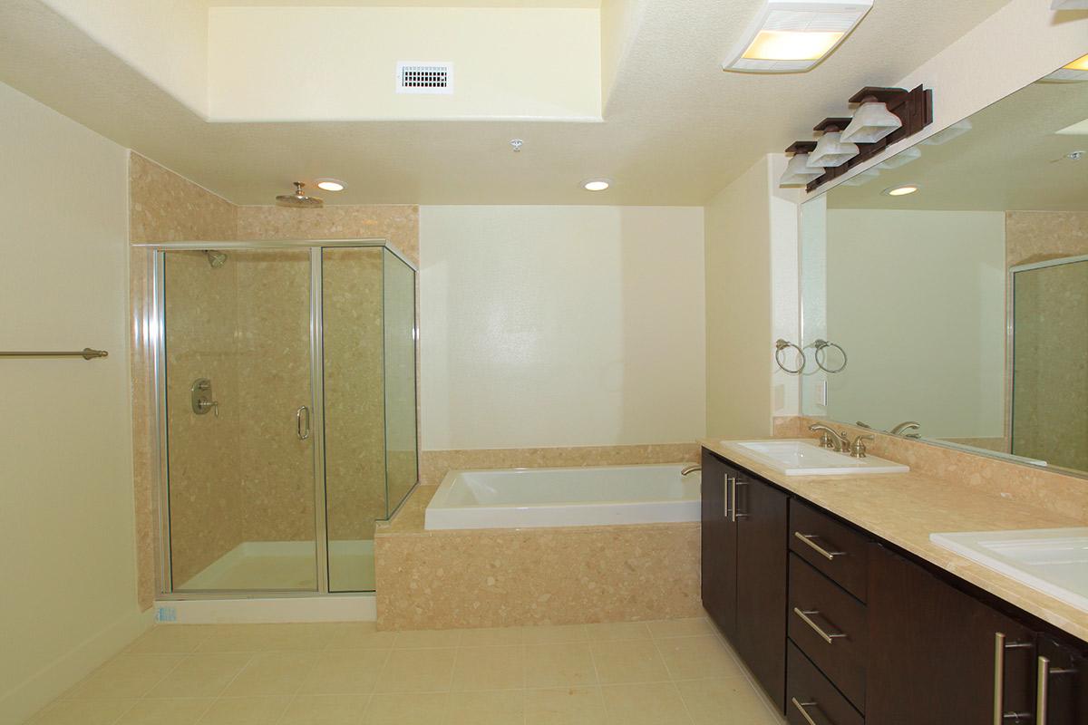 a kitchen with a sink and a mirror