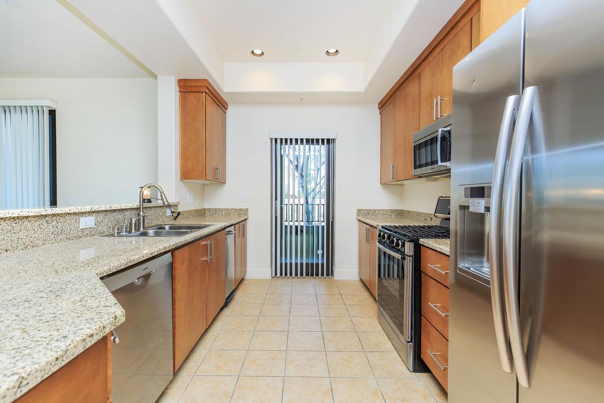 a modern kitchen with stainless steel appliances