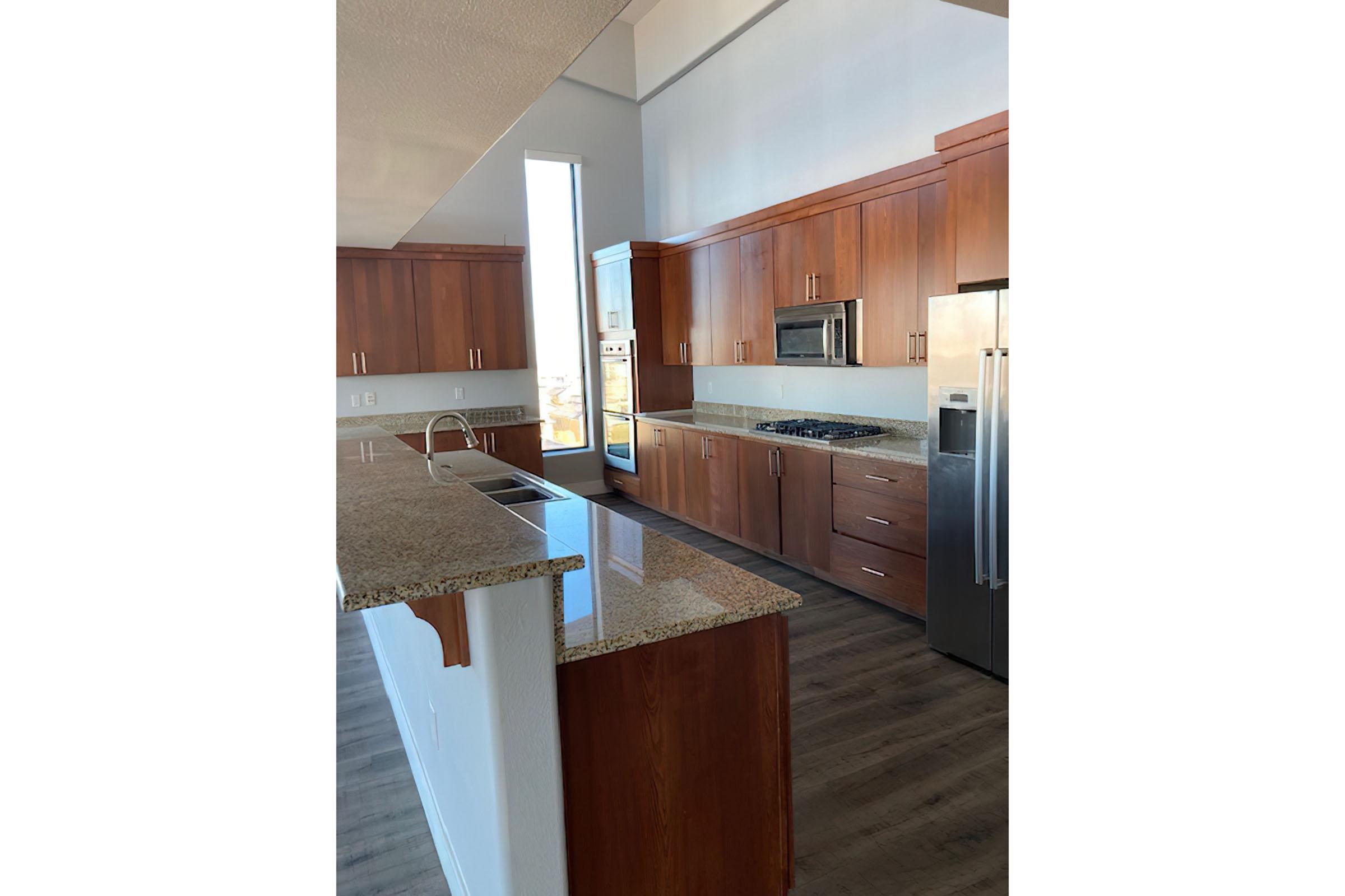 a kitchen with wooden cabinets