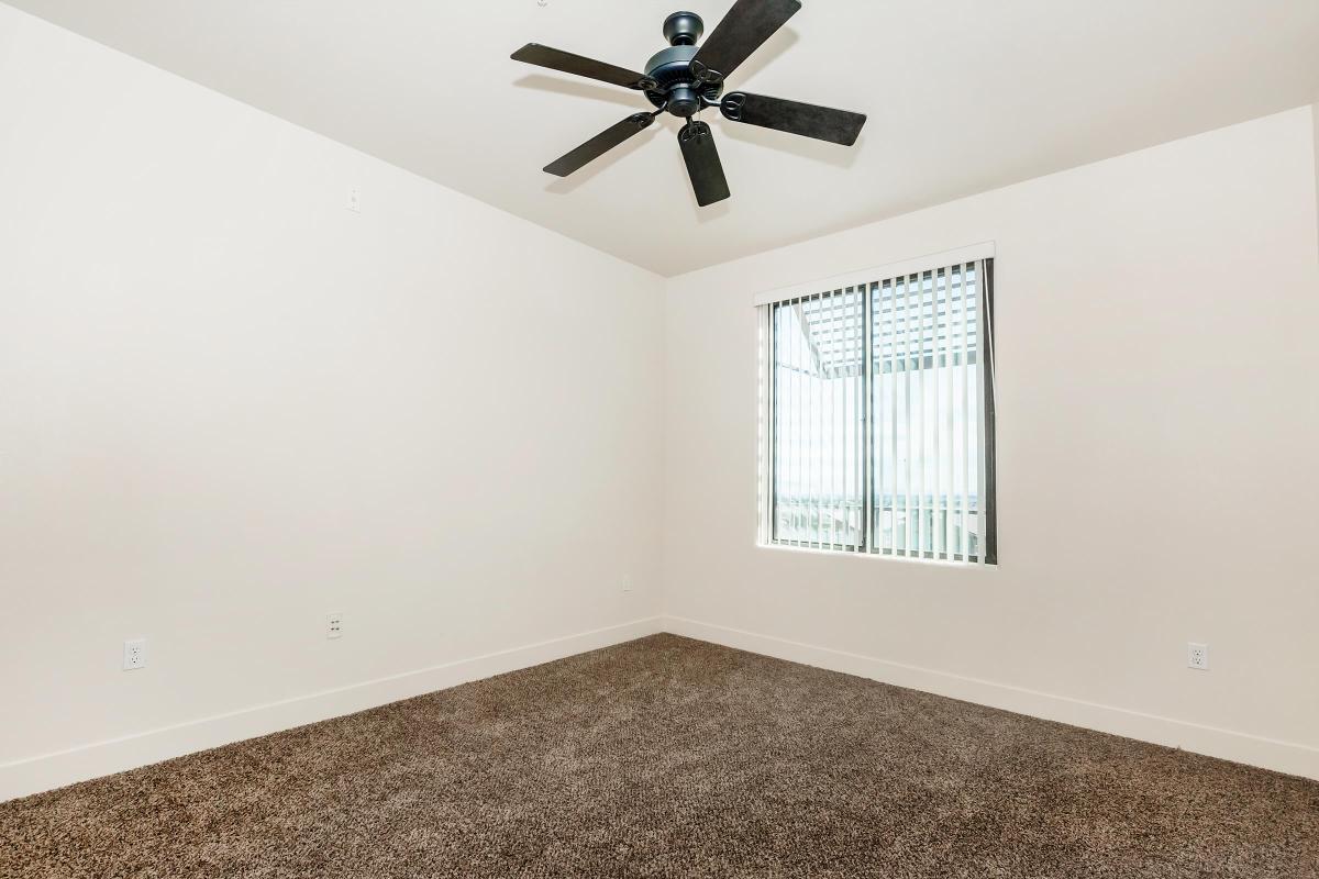 a bedroom with a large window