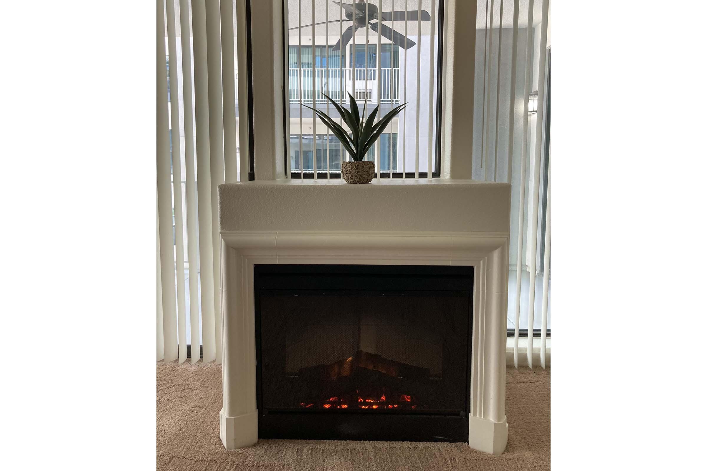 a fire place sitting in a window