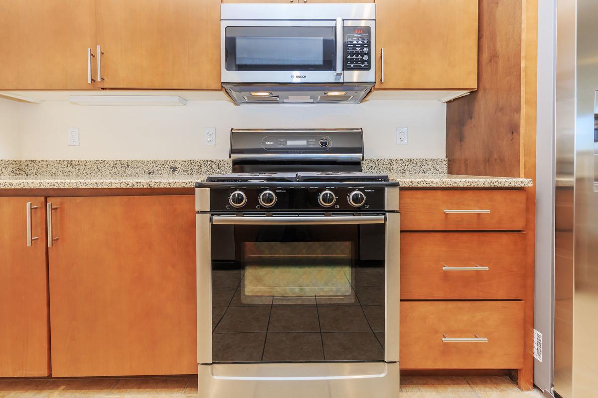 ECHELON AT CENTENNIAL HILLS IN LAS VEGAS HAS DESIGNER KITCHENS WITH STAINLESS STEEL APPLIANCES