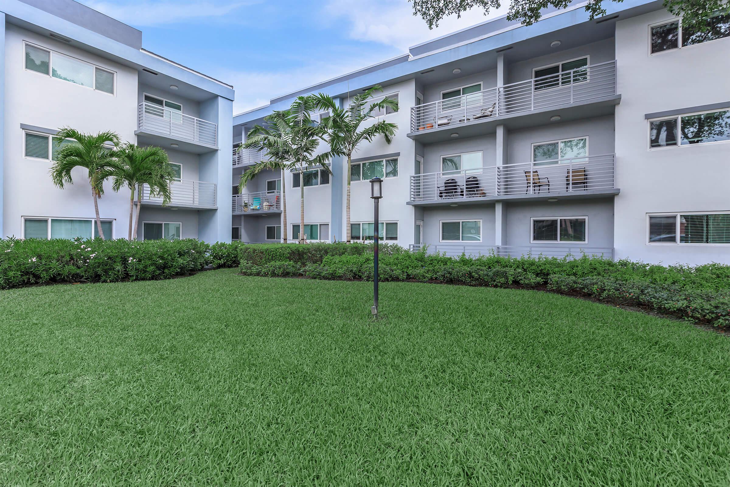 a large lawn in front of a building