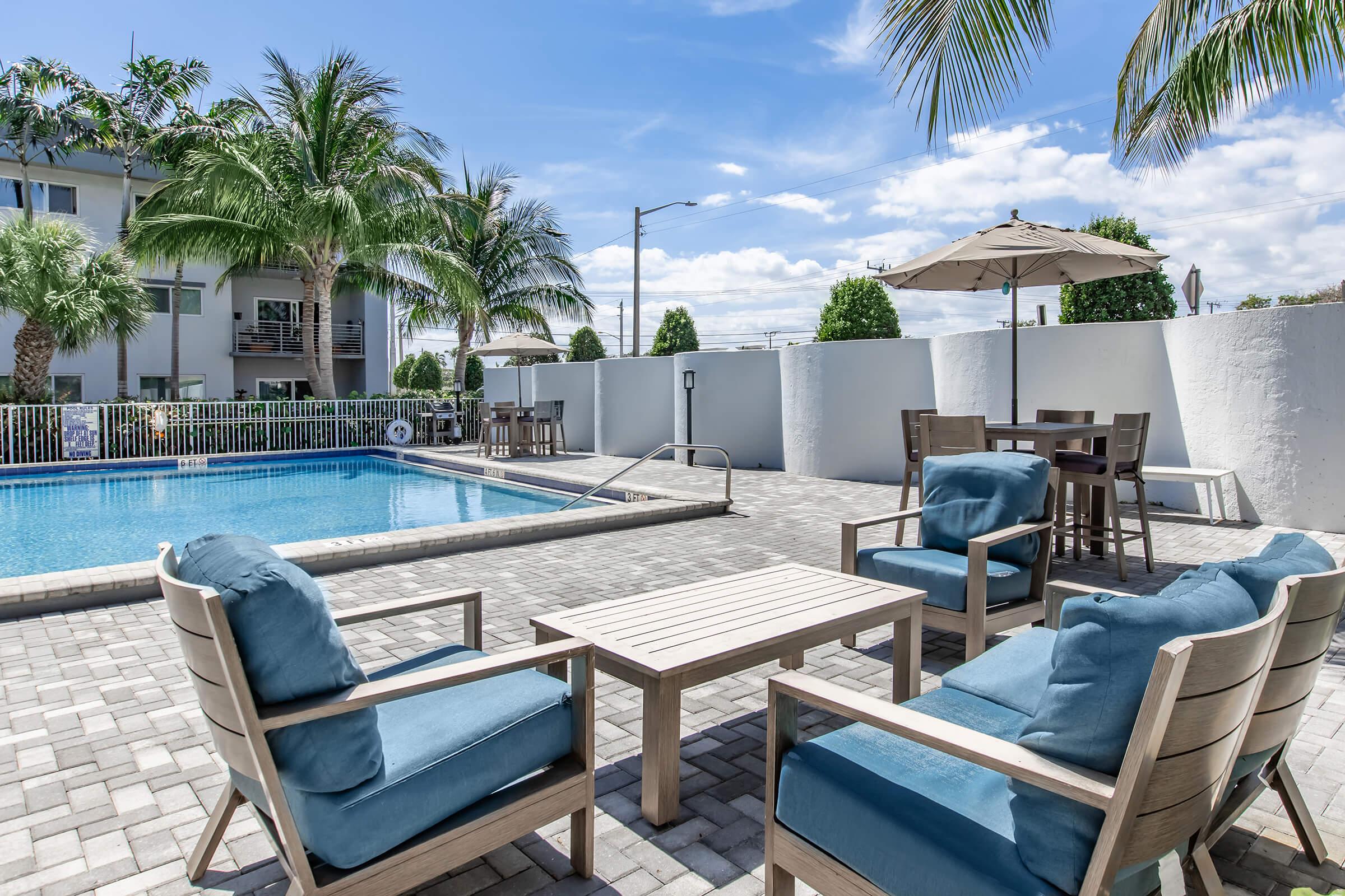 a chair sitting in front of a pool