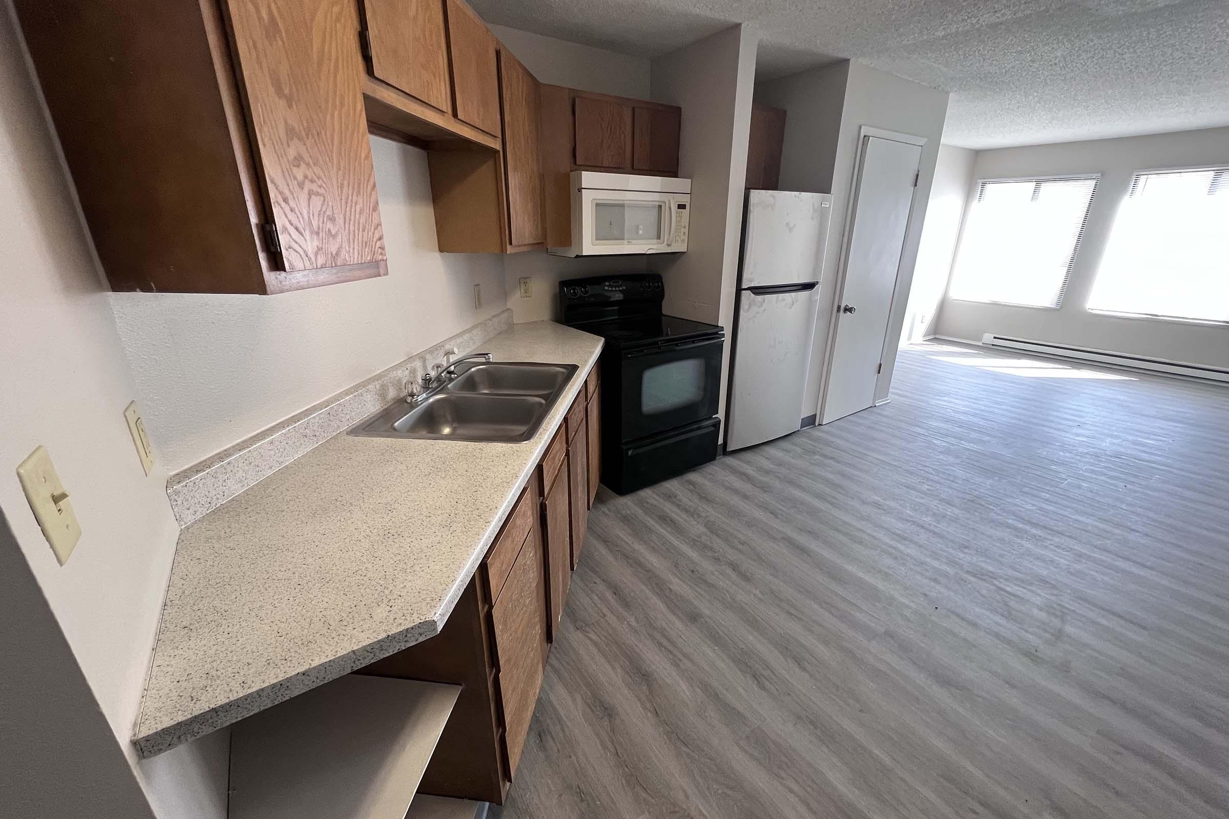 a stove top oven sitting inside of a kitchen