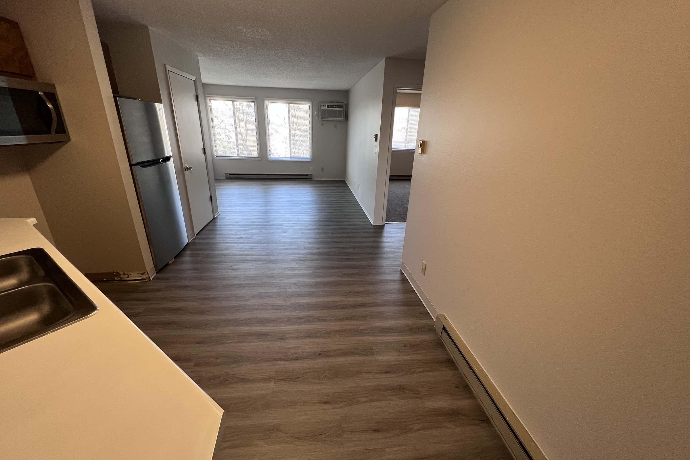 a kitchen with a wooden floor