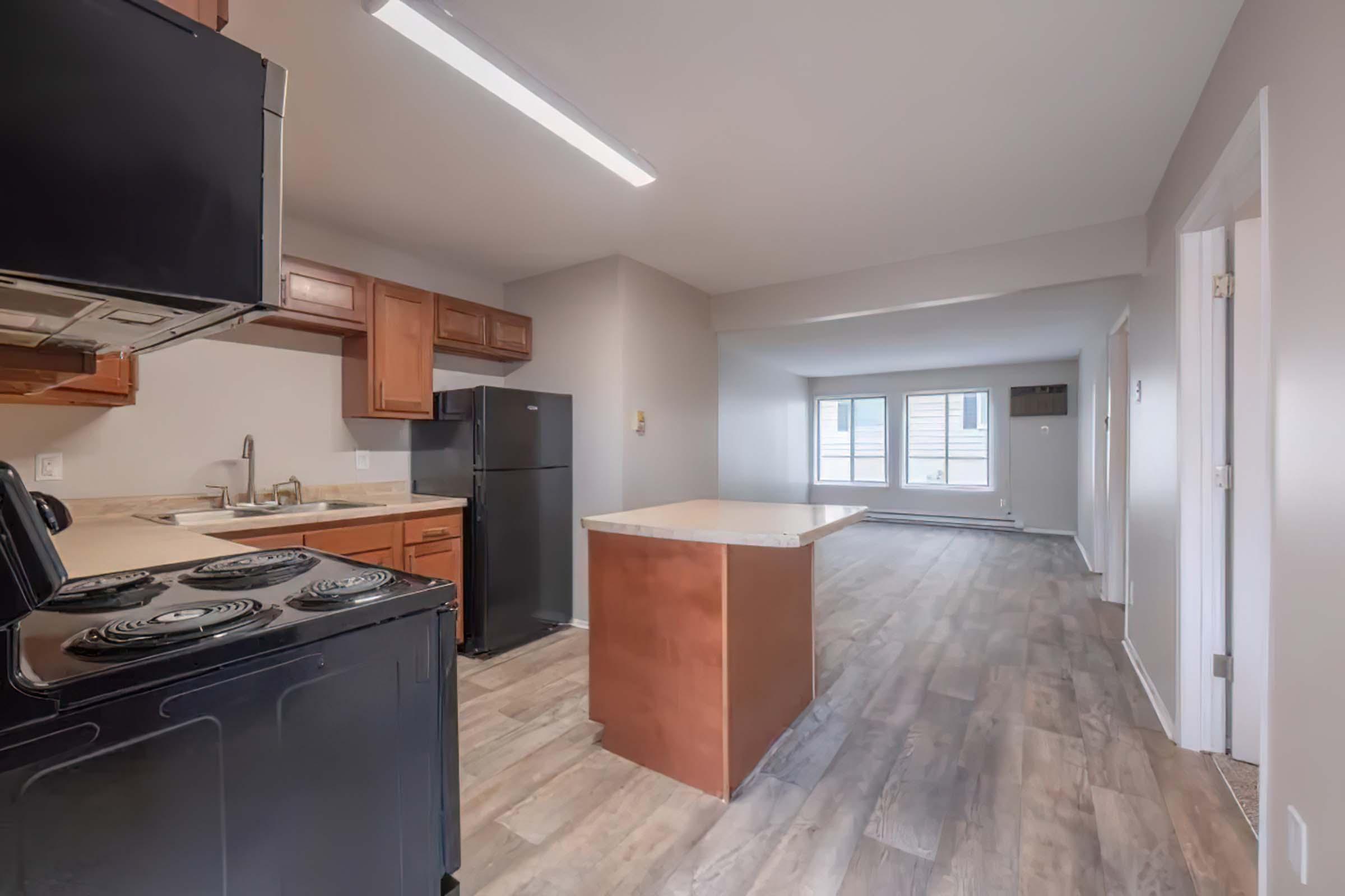 a kitchen with a wood floor