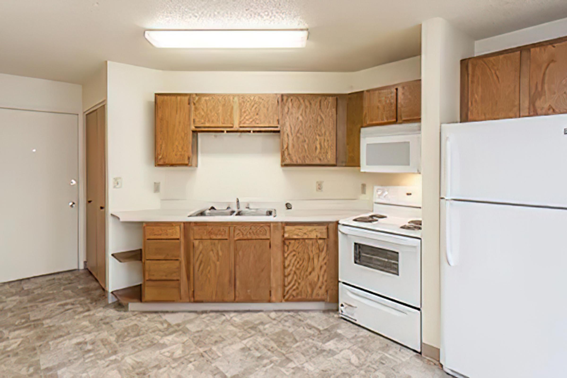 a kitchen with a stove top oven sitting inside of a refrigerator