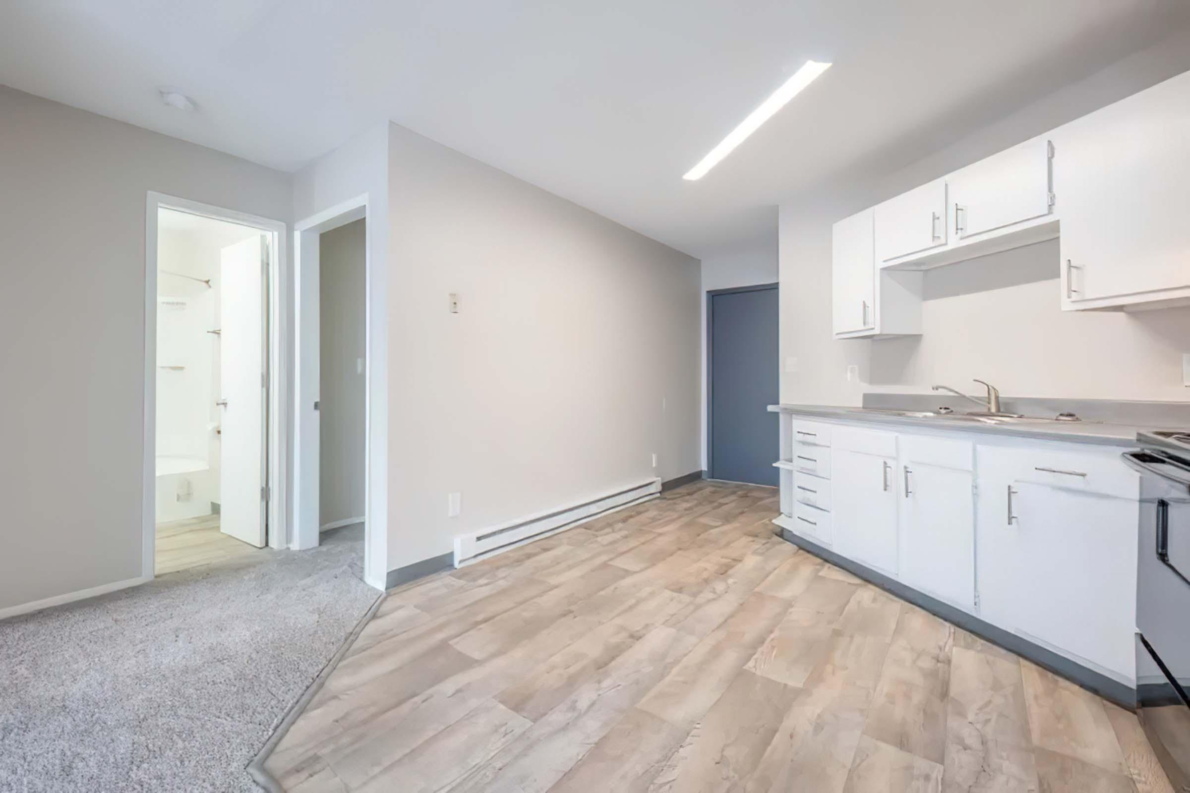 a kitchen with a wooden floor