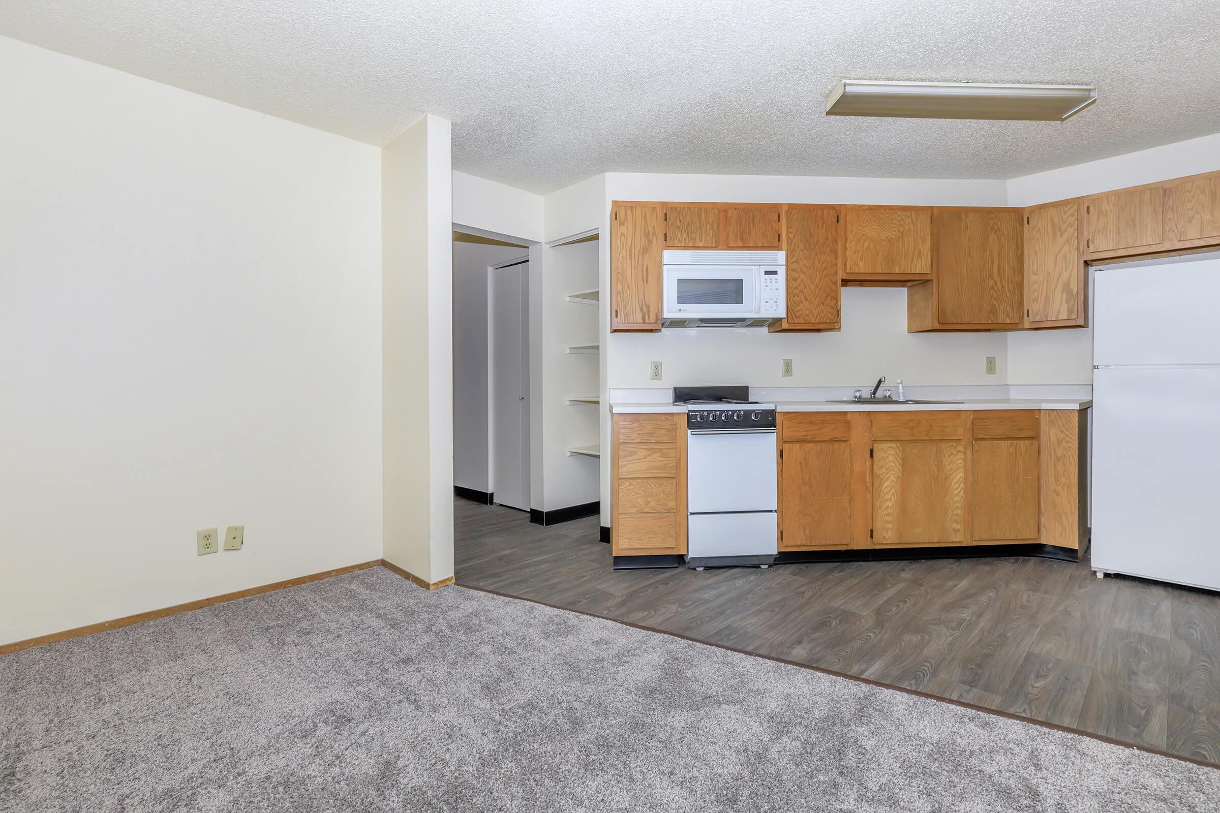 a kitchen with a stove and a refrigerator