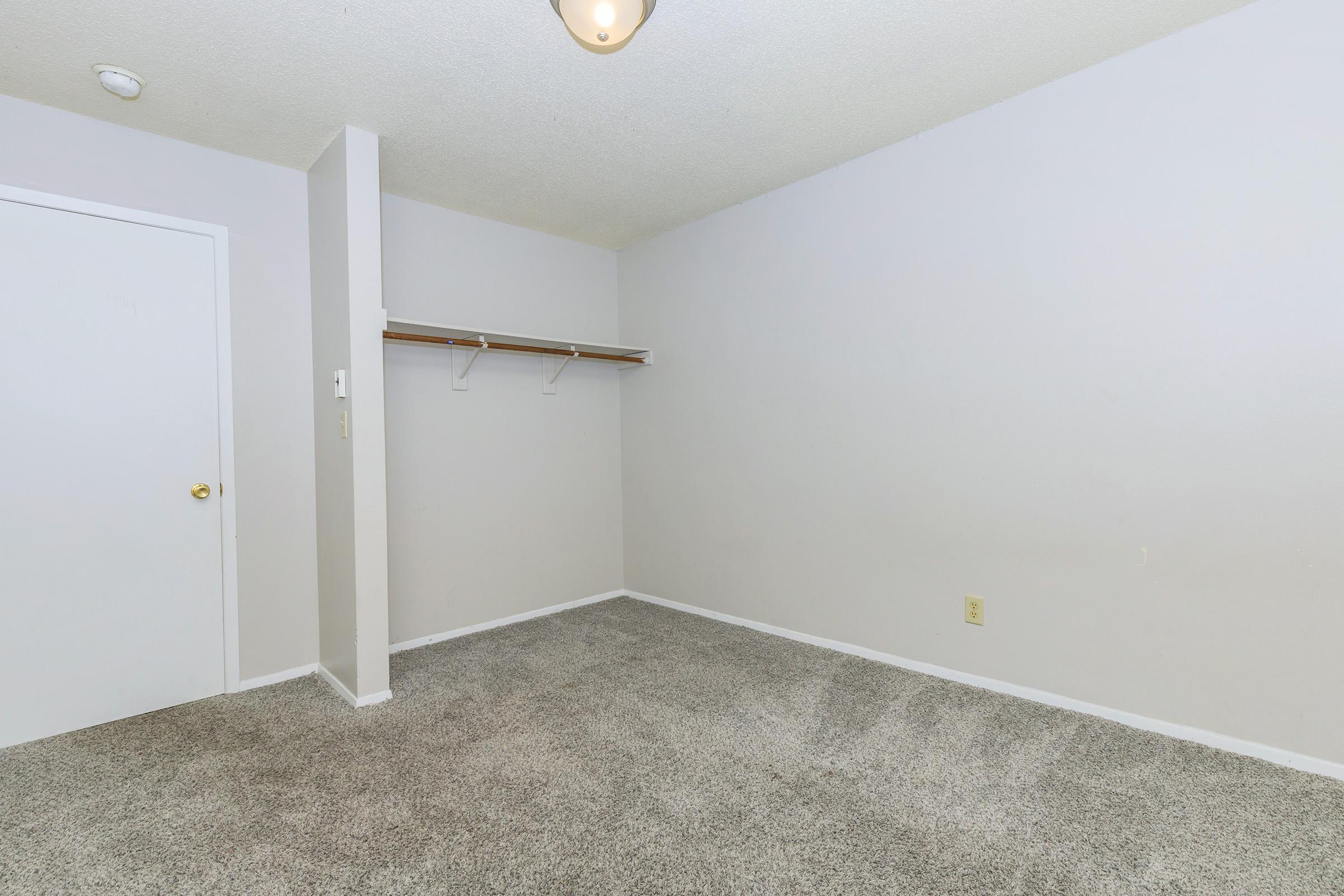 a bedroom with a large mirror