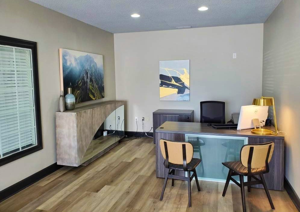 a living room filled with furniture and a tv