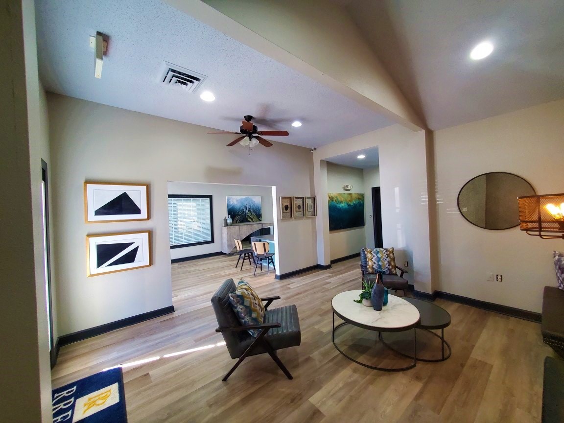 a living room with a large mirror