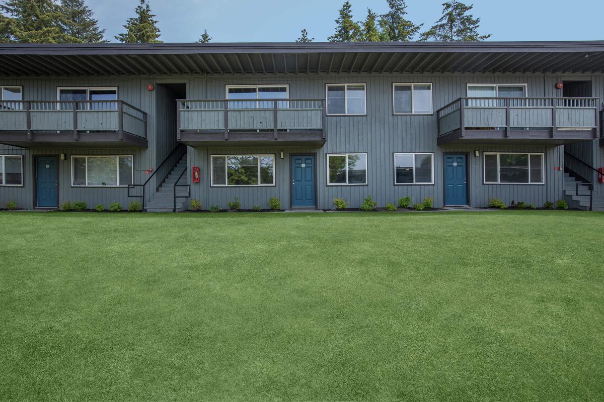 a large lawn in front of a house