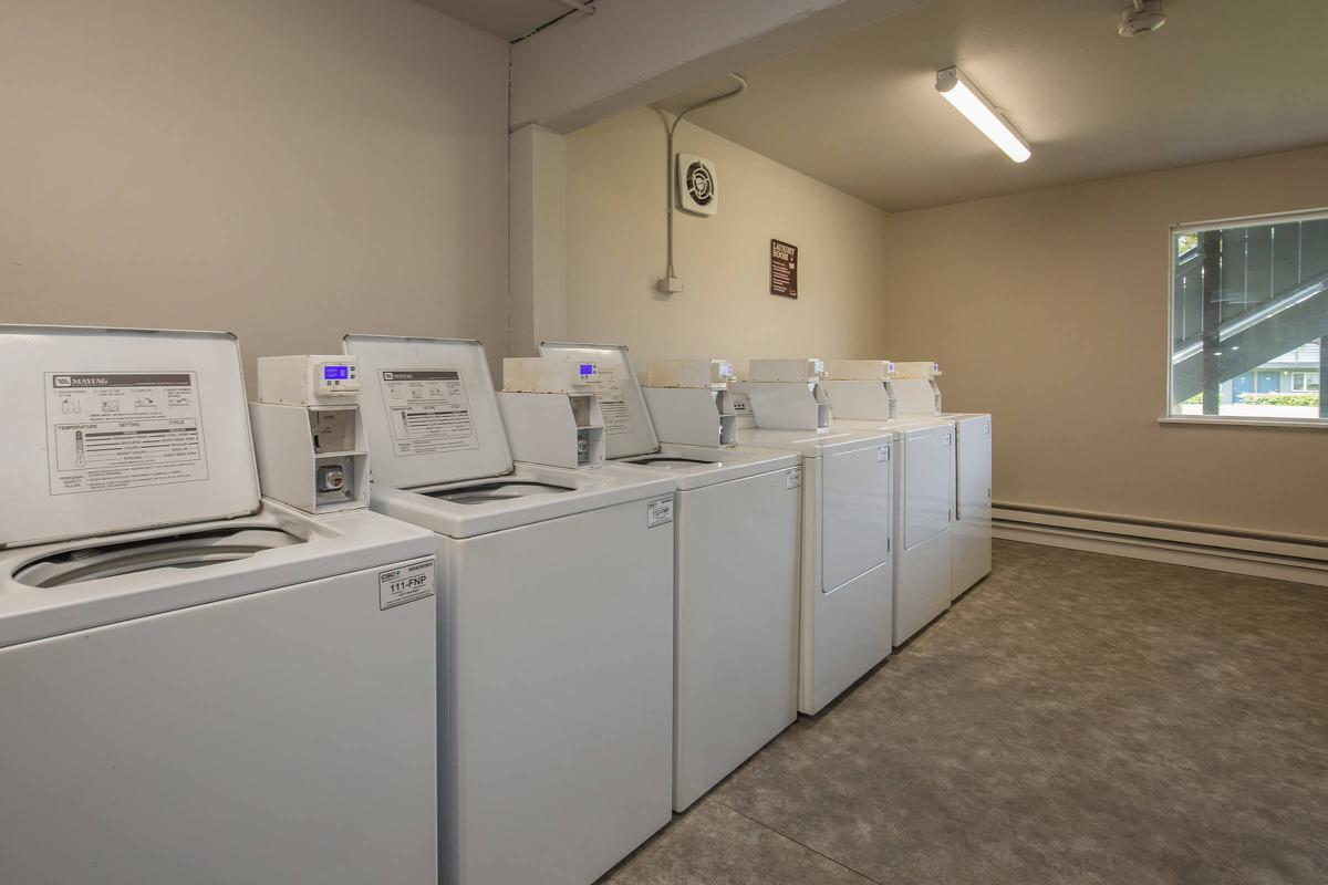 a white refrigerator freezer sitting inside of a kitchen