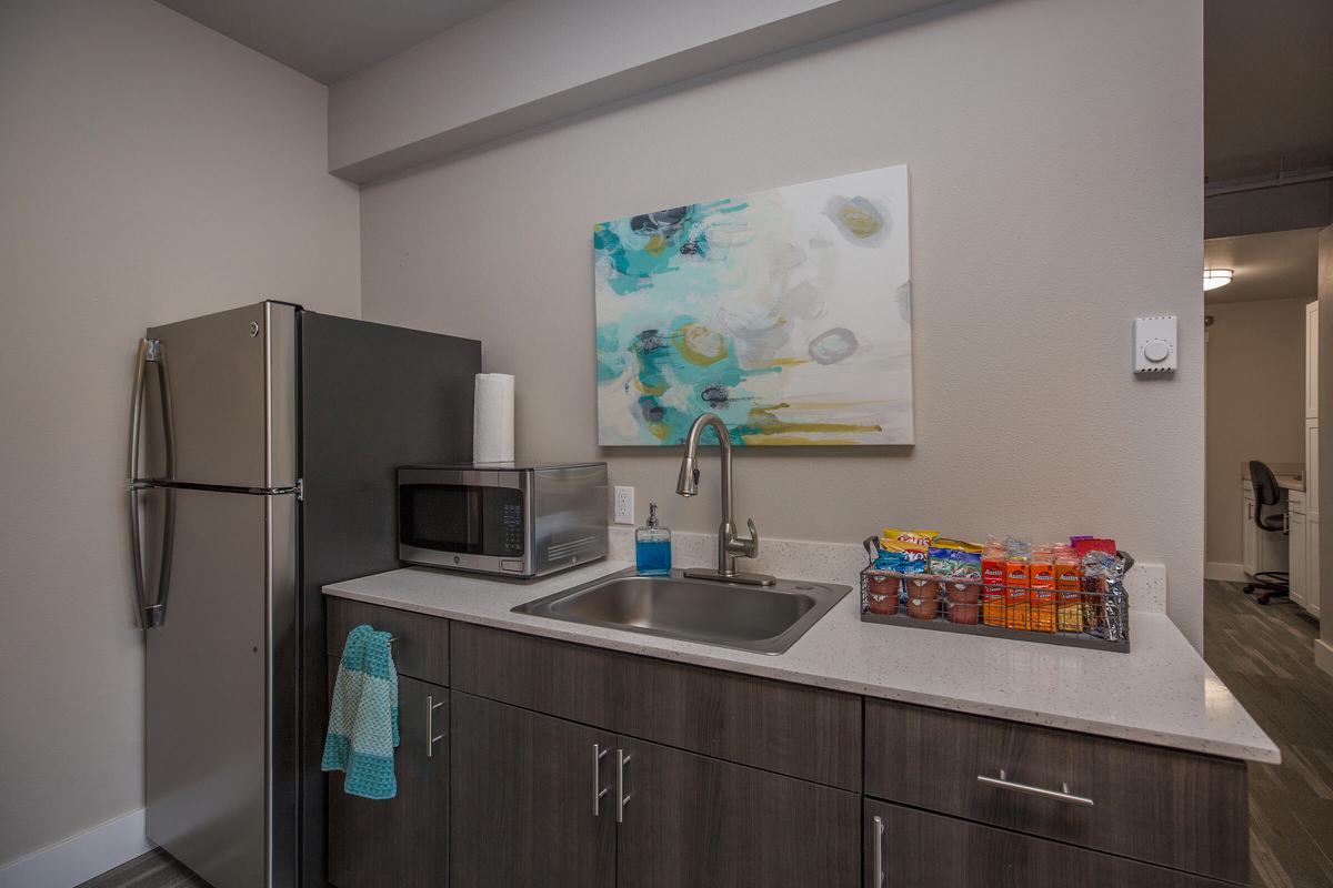 a kitchen with a sink and a refrigerator