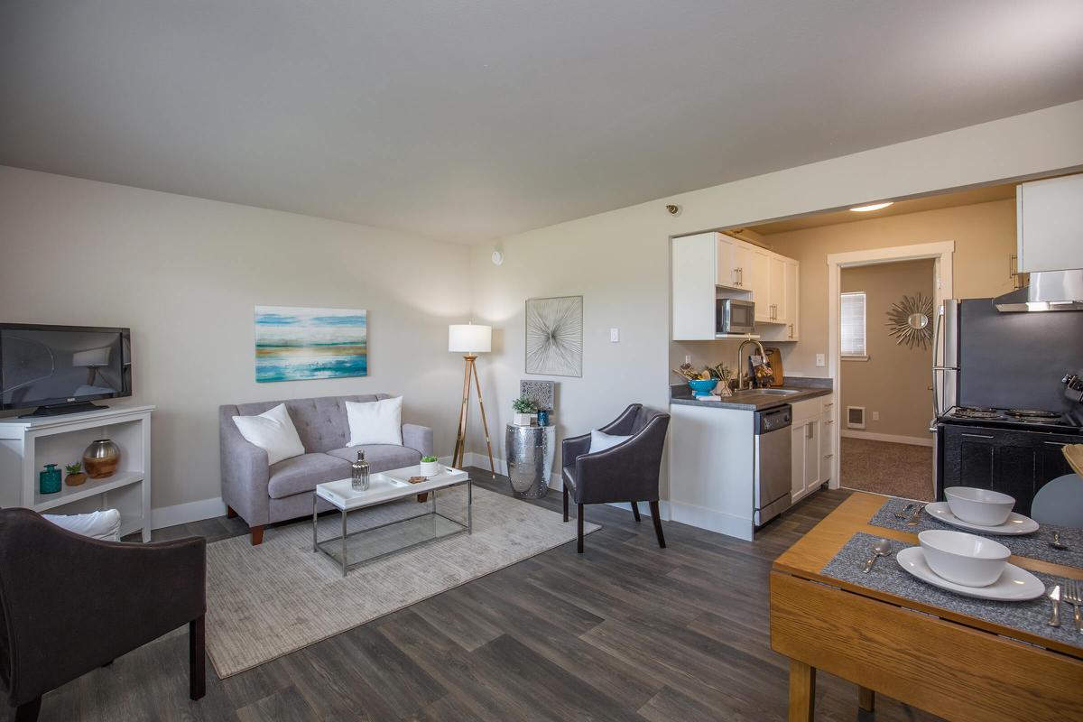 a living room filled with furniture and a table