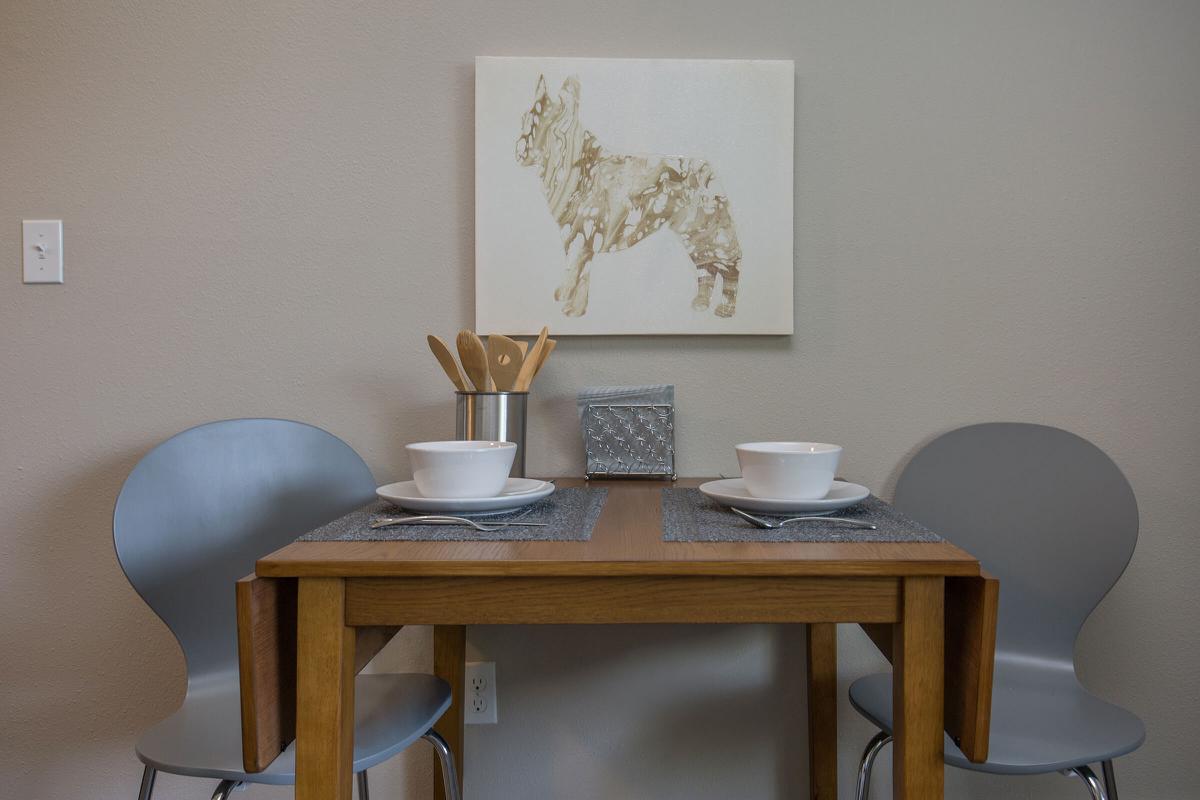 a desk with a lamp on a table