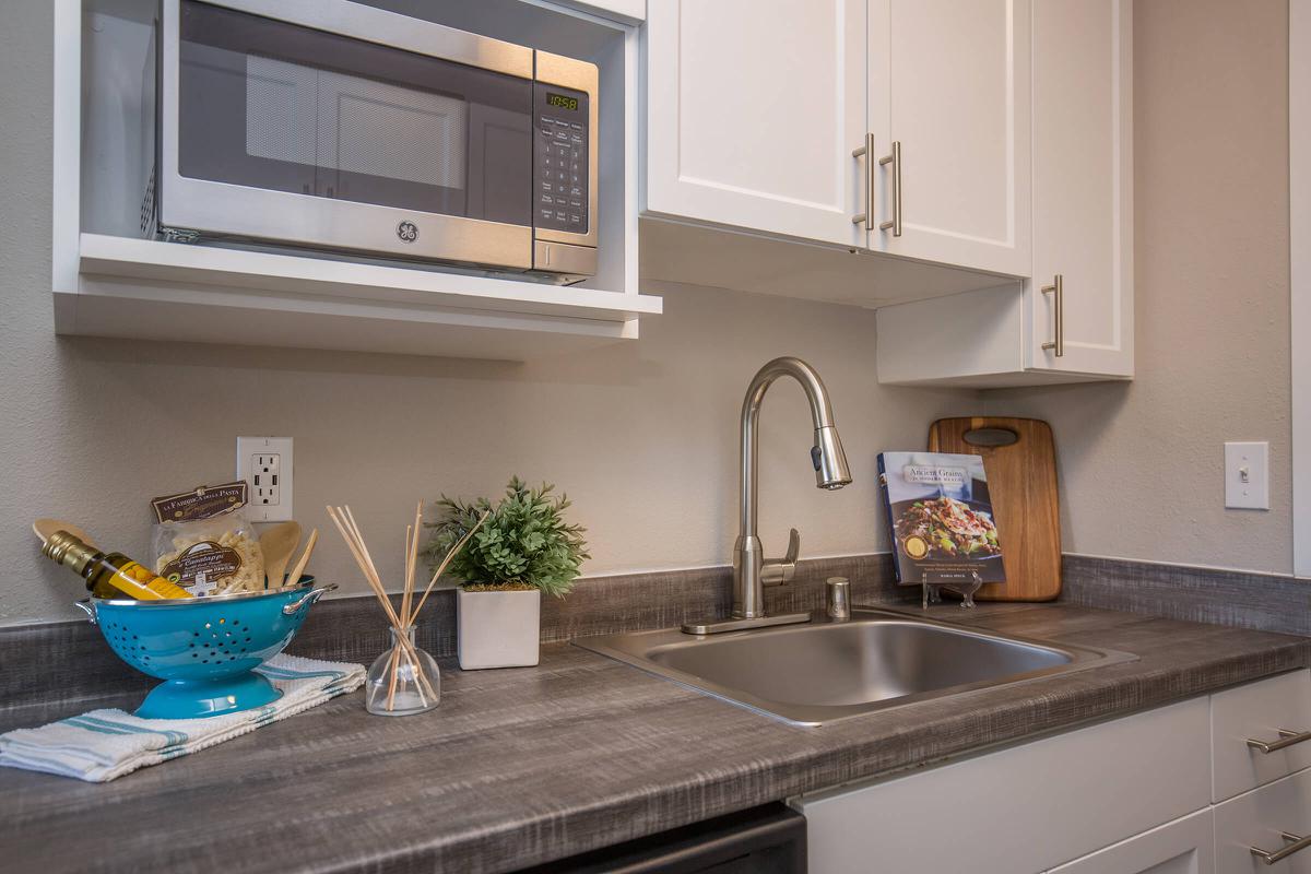 a kitchen with a sink and a window