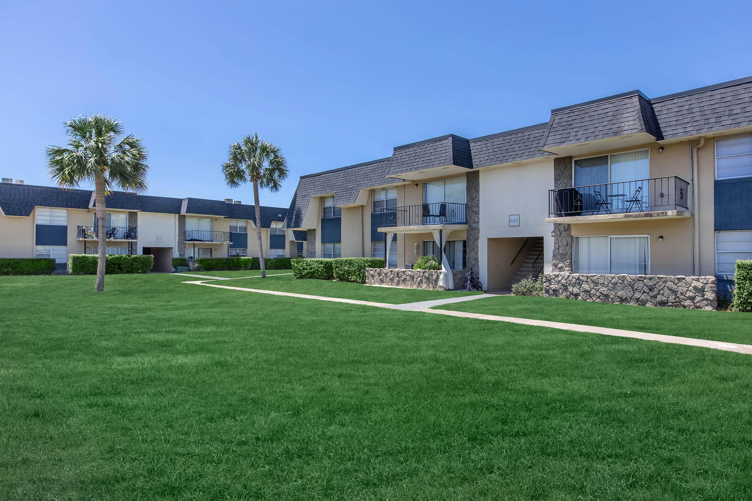 a large lawn in front of a house