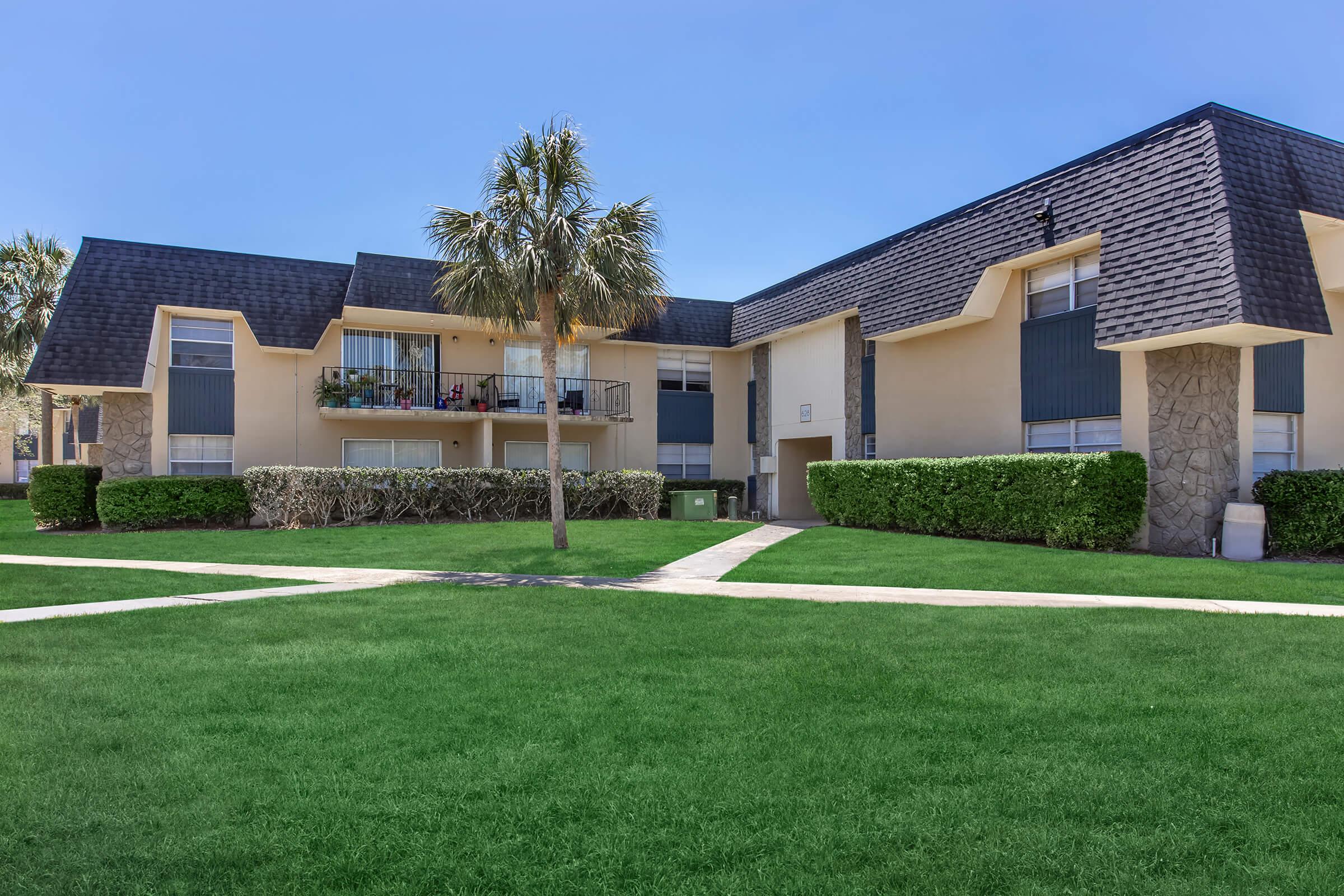 a large lawn in front of a house