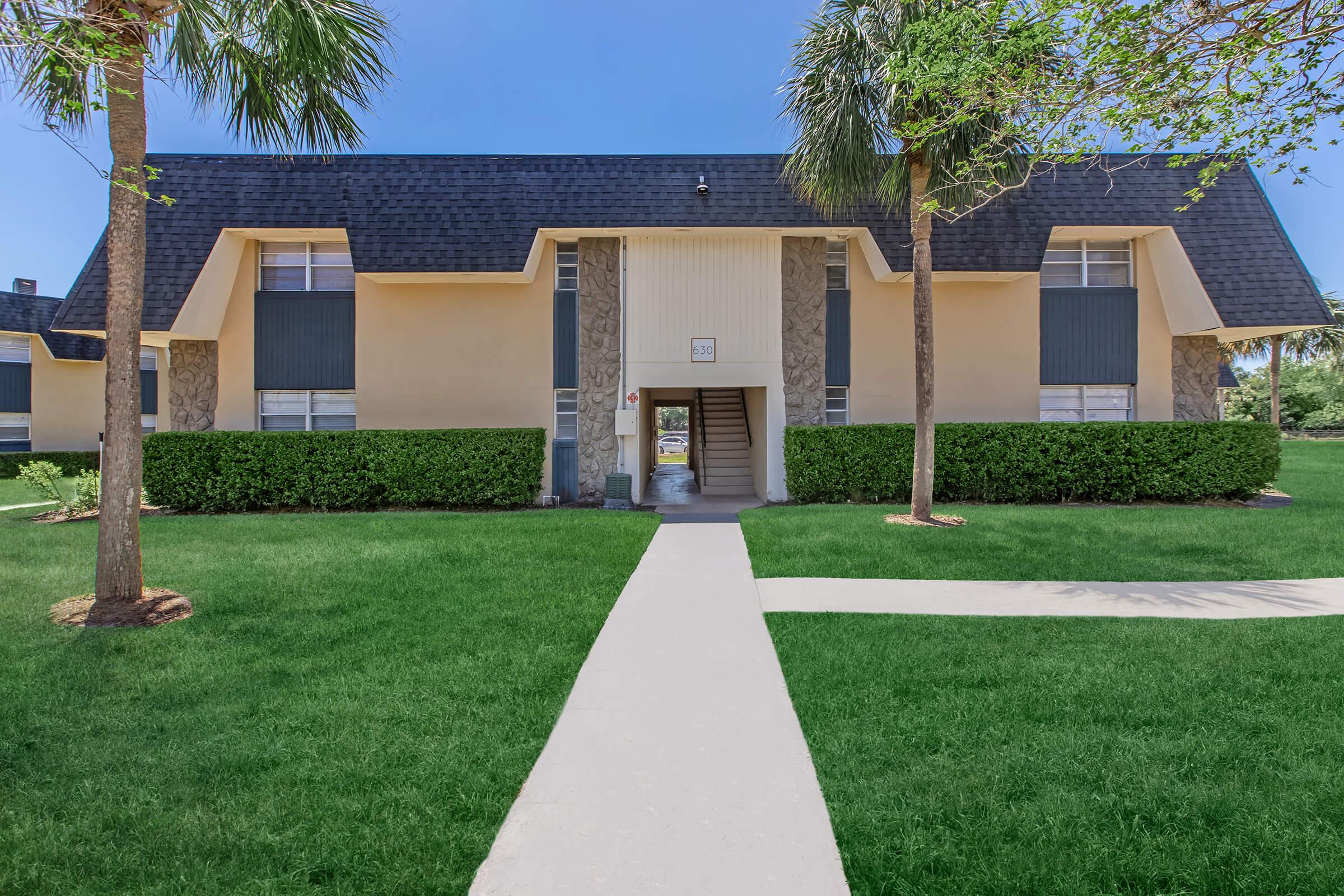 a large lawn in front of a house