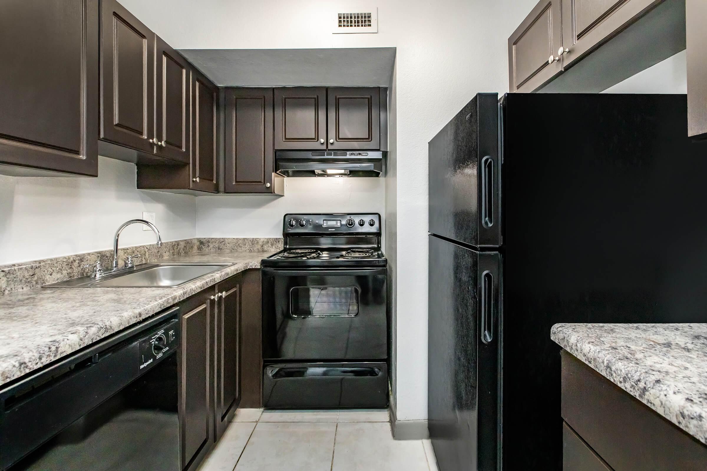 a large kitchen with stainless steel appliances