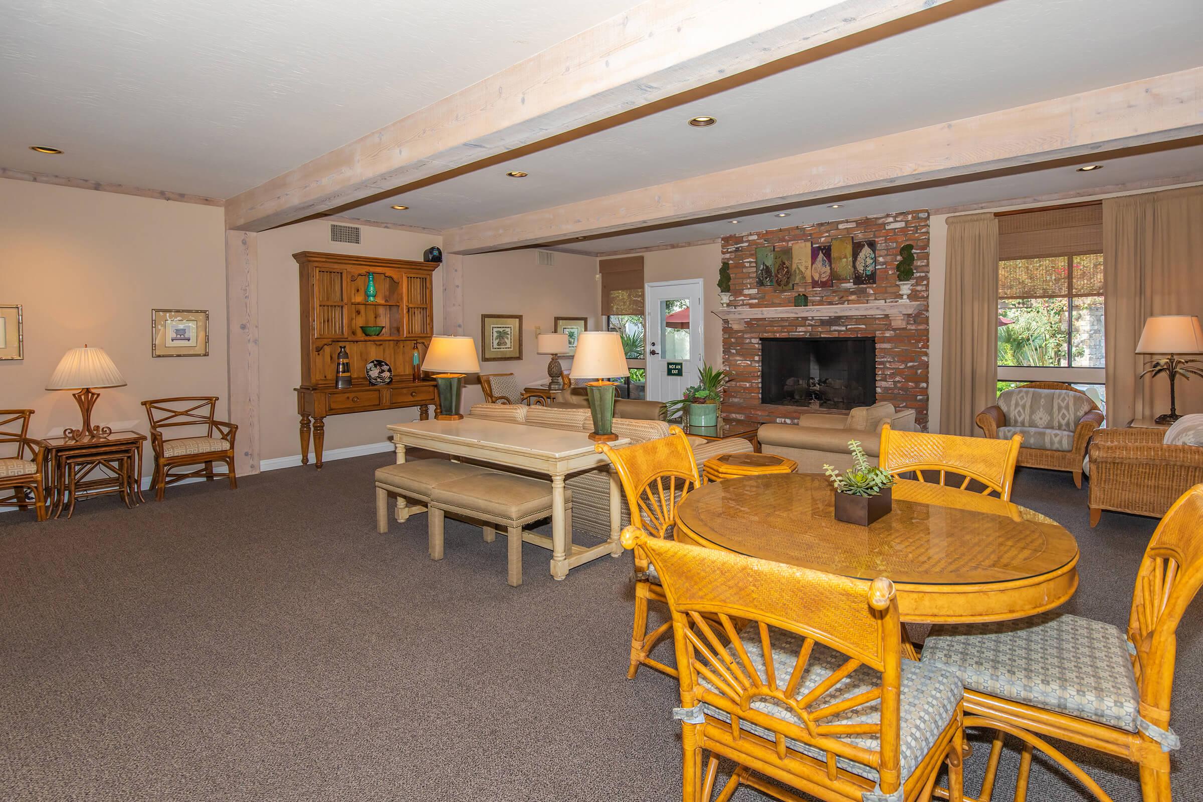 Moss Creek Apartments community room with a fireplace