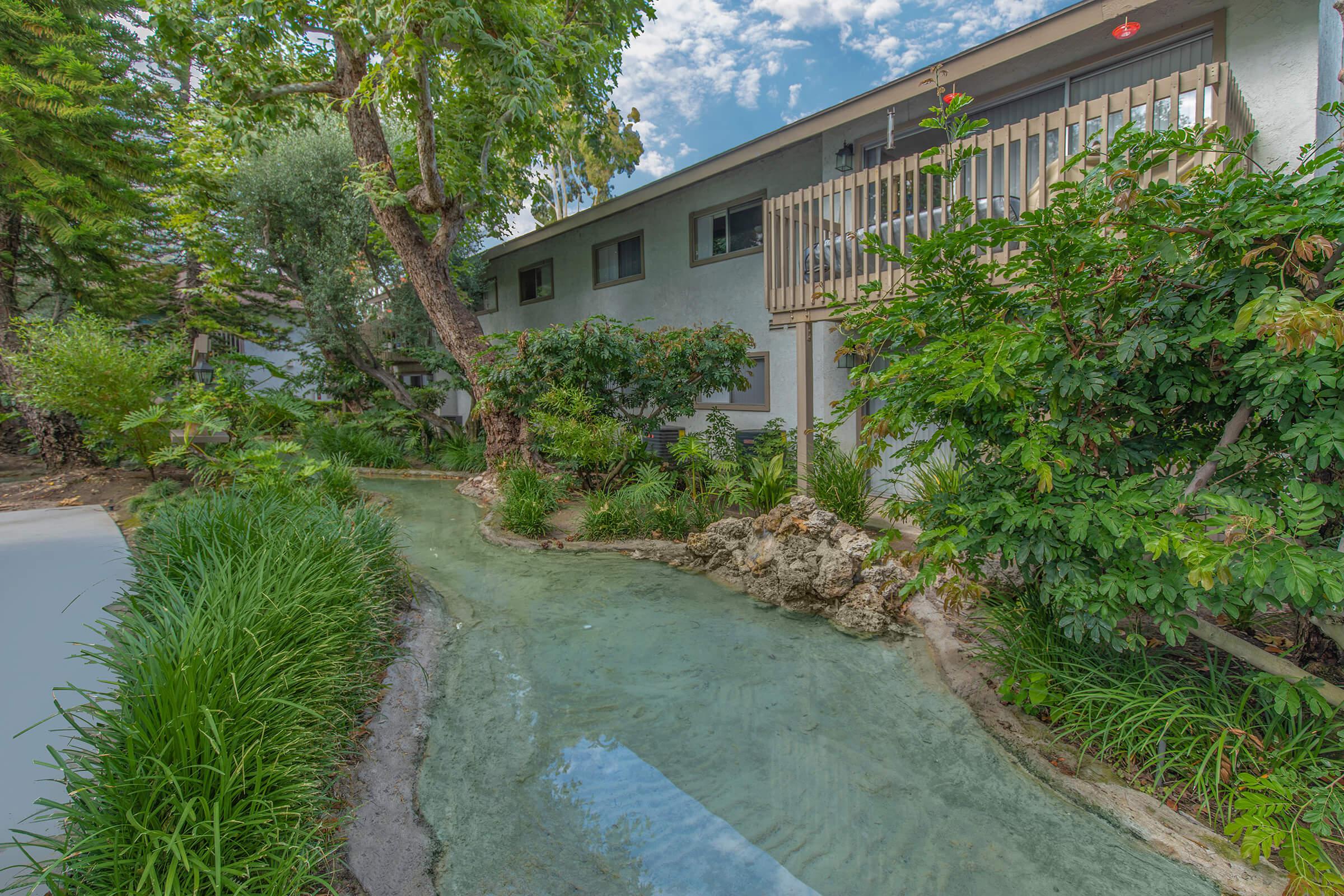 Moss Creek Apartments creek behind a community building