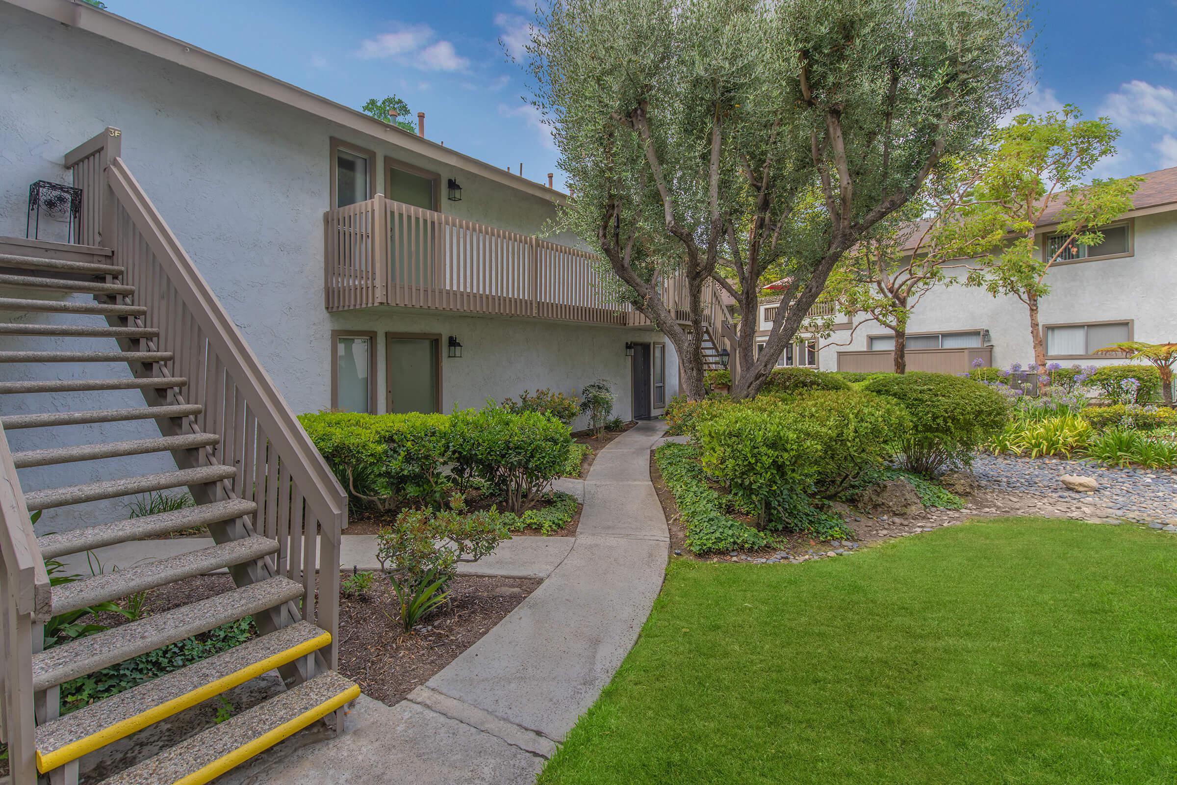 Moss Creek Apartments community buildings with green landscaping