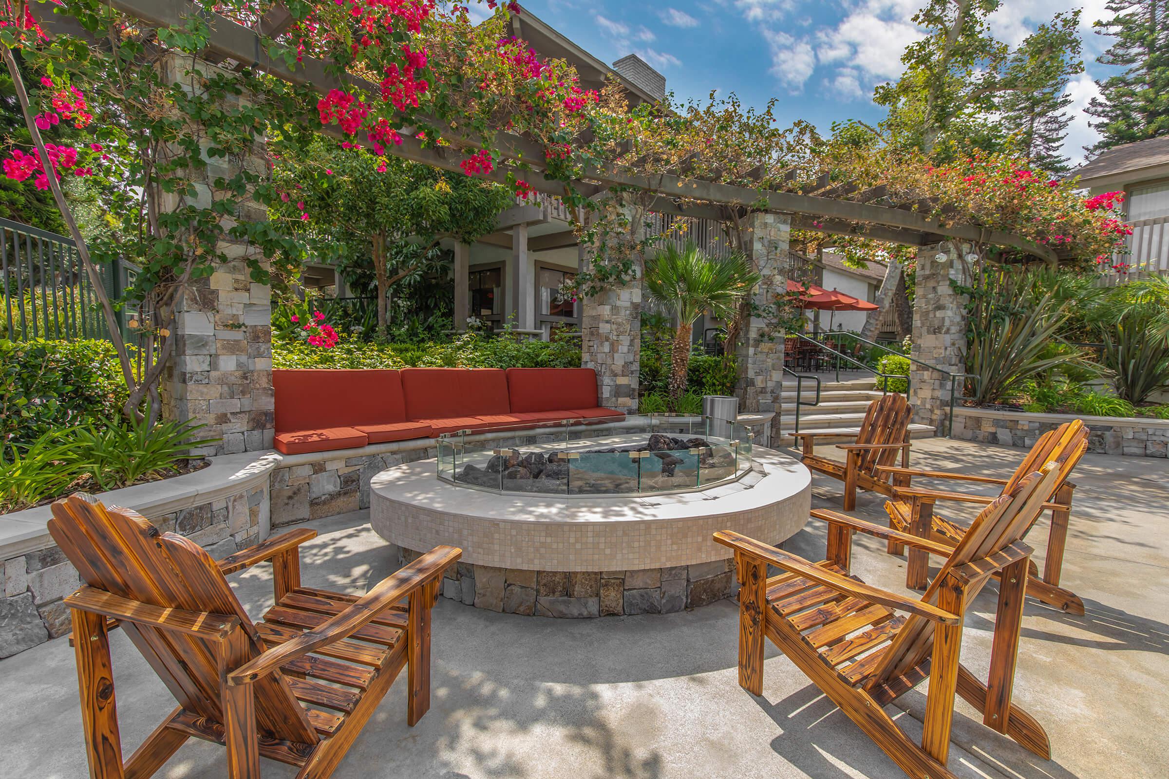 community firepit with wooden chairs