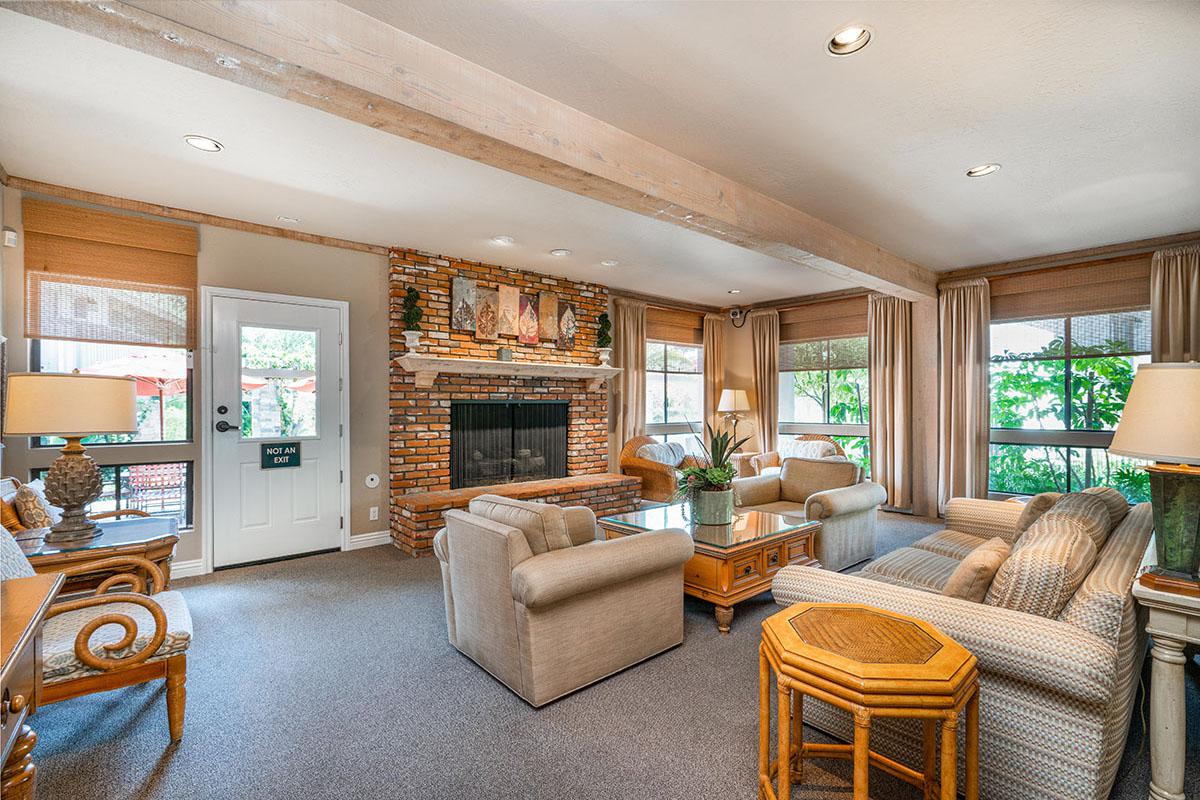 a living room filled with furniture and a large window