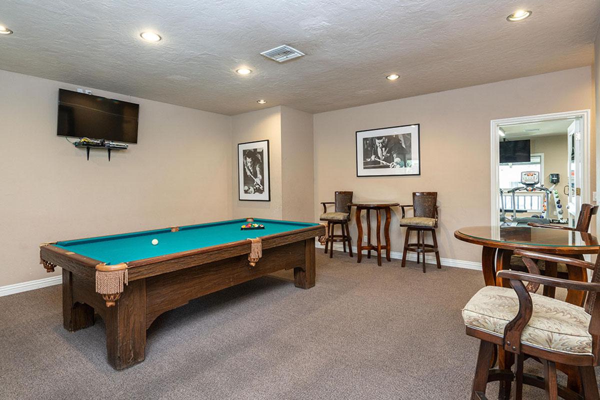 a living room filled with furniture and a table